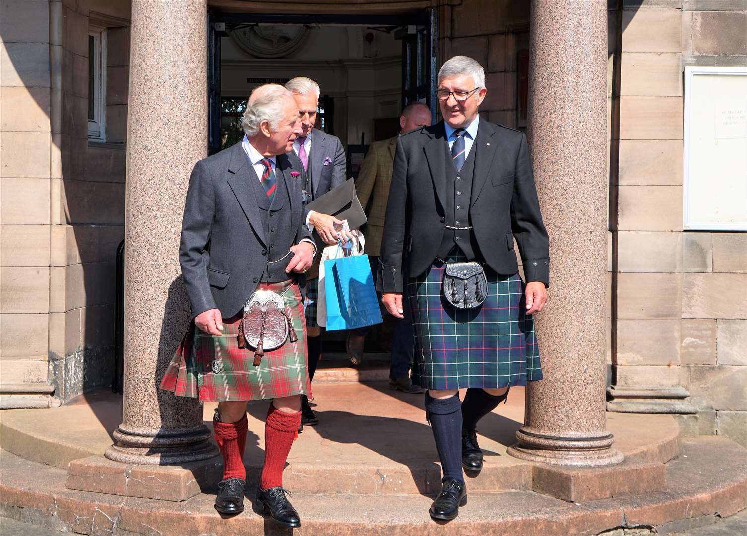 HRH Prince Charles leaves the Carnegie building accompanied by the Vice Lord Lieutenant of Caithness Willie Watt. Picture: DGS