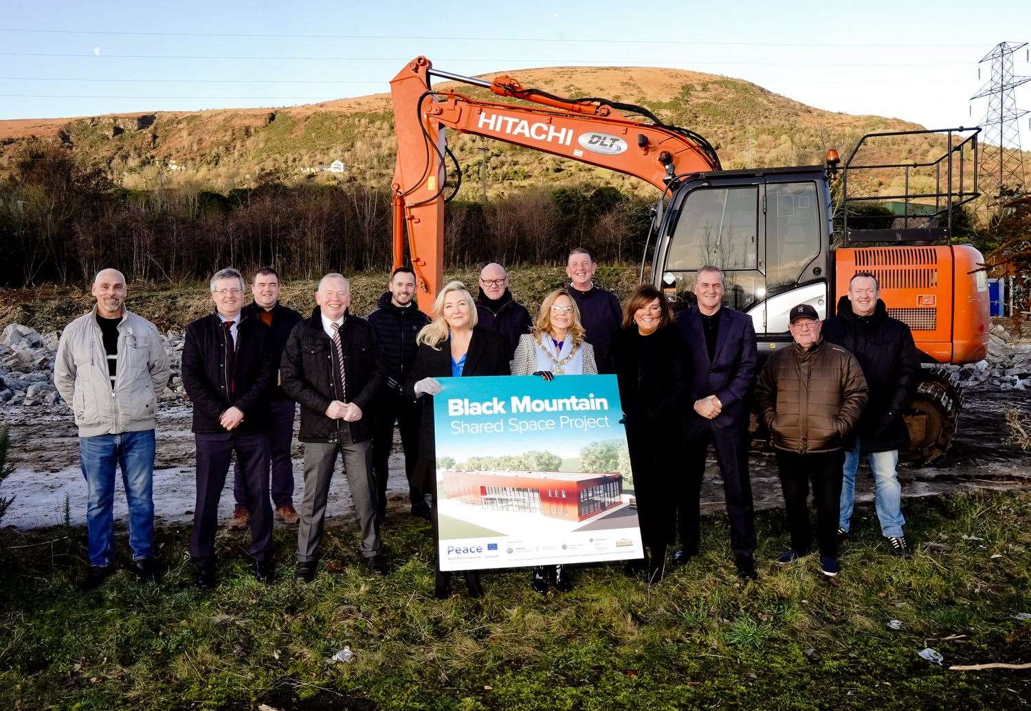 Belfast Lord Mayor Tina Black (right, holding sign) breaking ground with board members and staff of the Black Mountain Shared Space Project (Seamus Corr of Black Mountain Shared Space Project/PA)