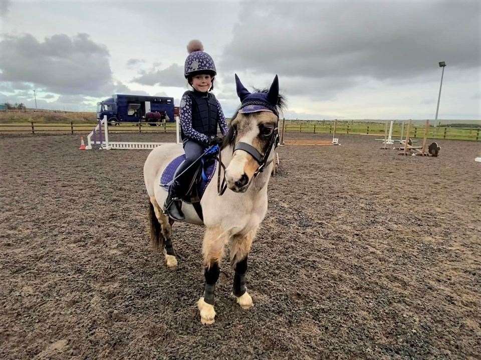 Six-year-old Rachel MacGregor and Dandy looking great in their 'matchy matchy' gear, winners of the first class of the day.