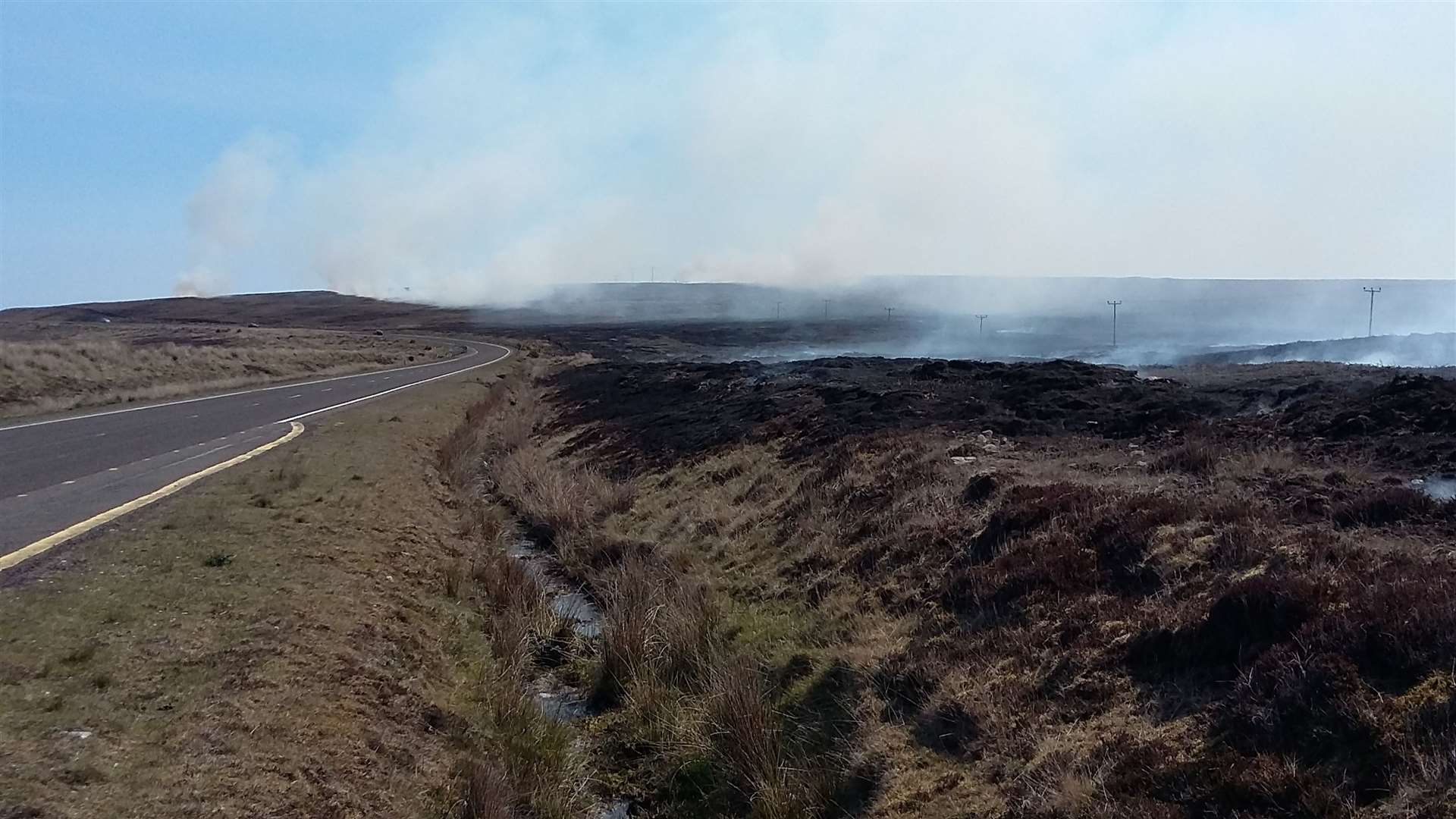 Looking east on the A836 at the site of the Melvich moor fire. Picture: Matthew Reiss.