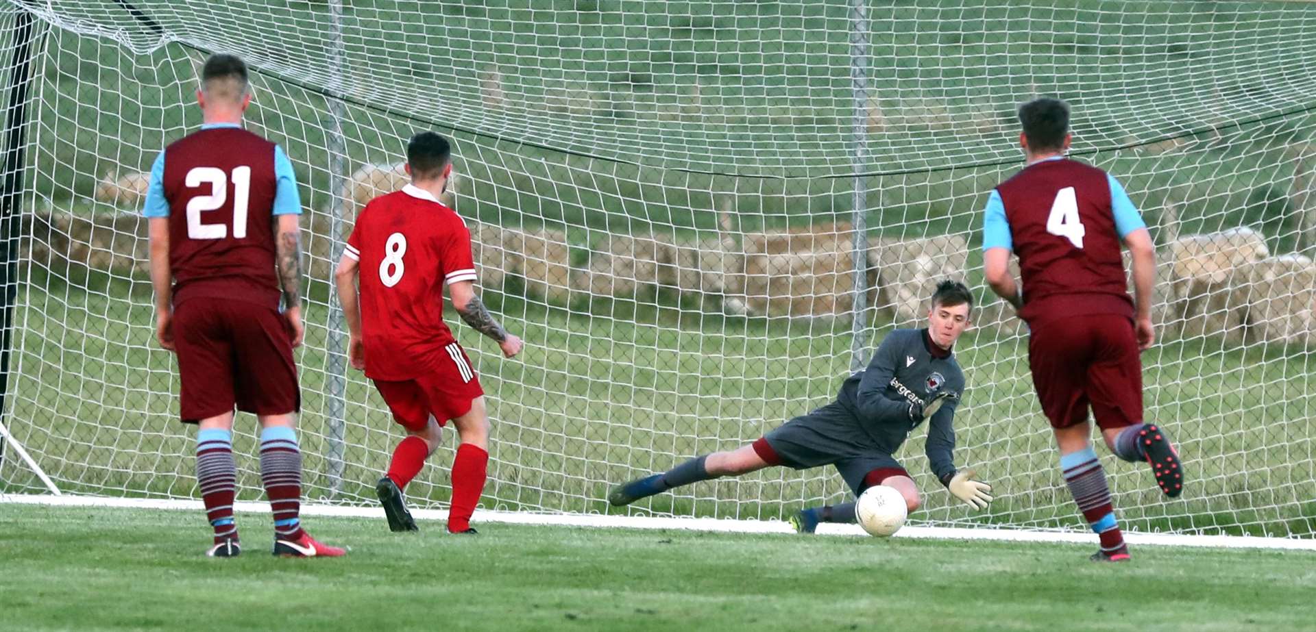 Pentland United goalkeeper Mackenzie Beaton saves Ben Sinclair's penalty but Sinclair scored from the rebound. Picture: James Gunn