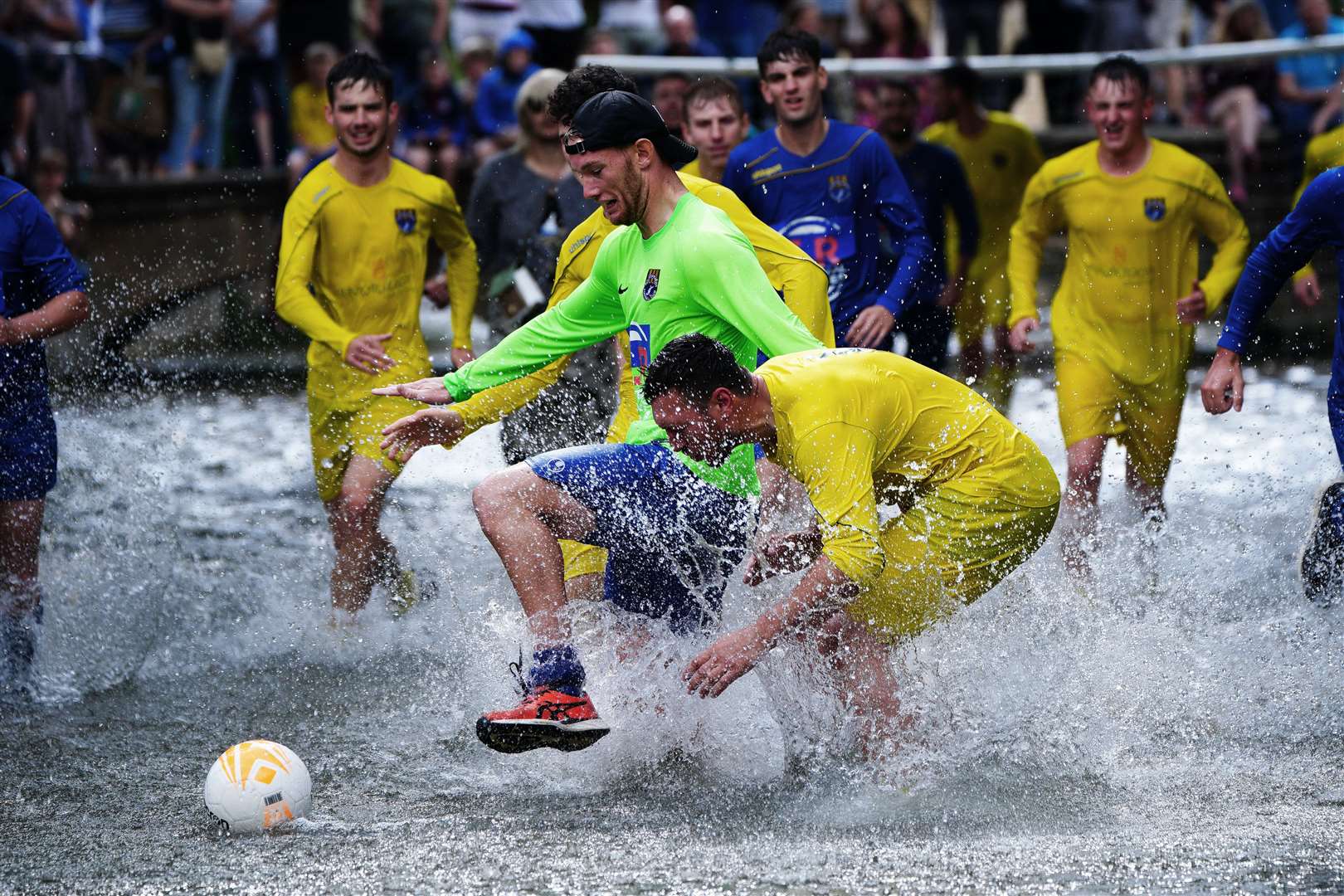 Footballers from Bourton Rovers don’t let a river put them off (Ben Birchall/PA)