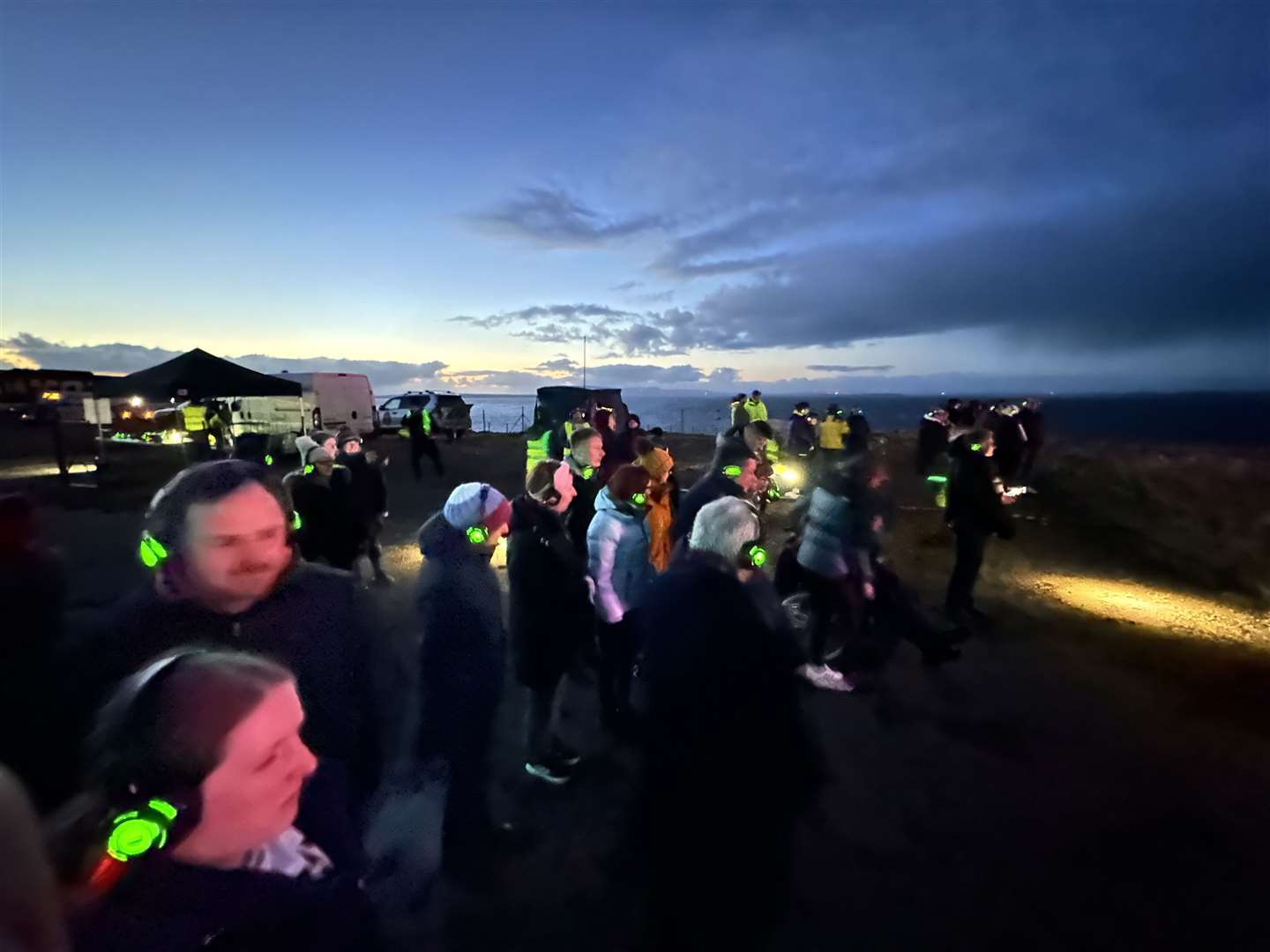 Some of the audience at Duncansby Head, with headsets supplied by Lyth Arts Centre team for the light and sound show. Picture: Mike Bullock