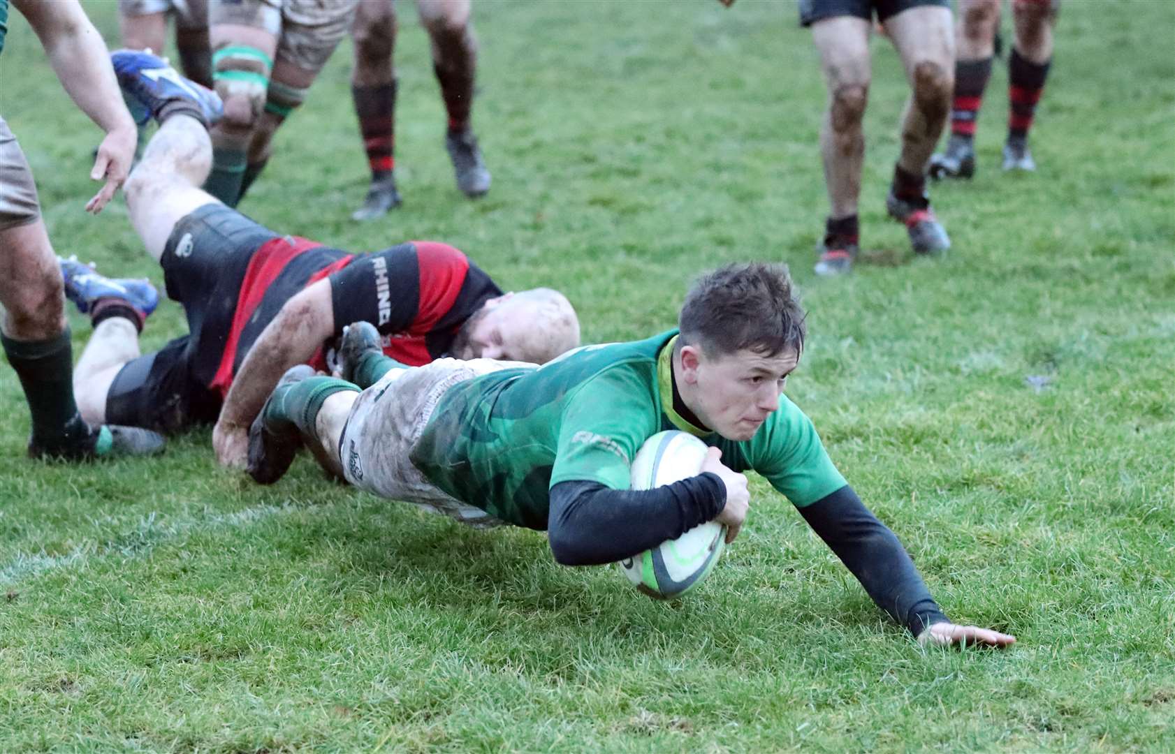 Scott Webster touches down for a try despite being tackled. Picture: James Gunn