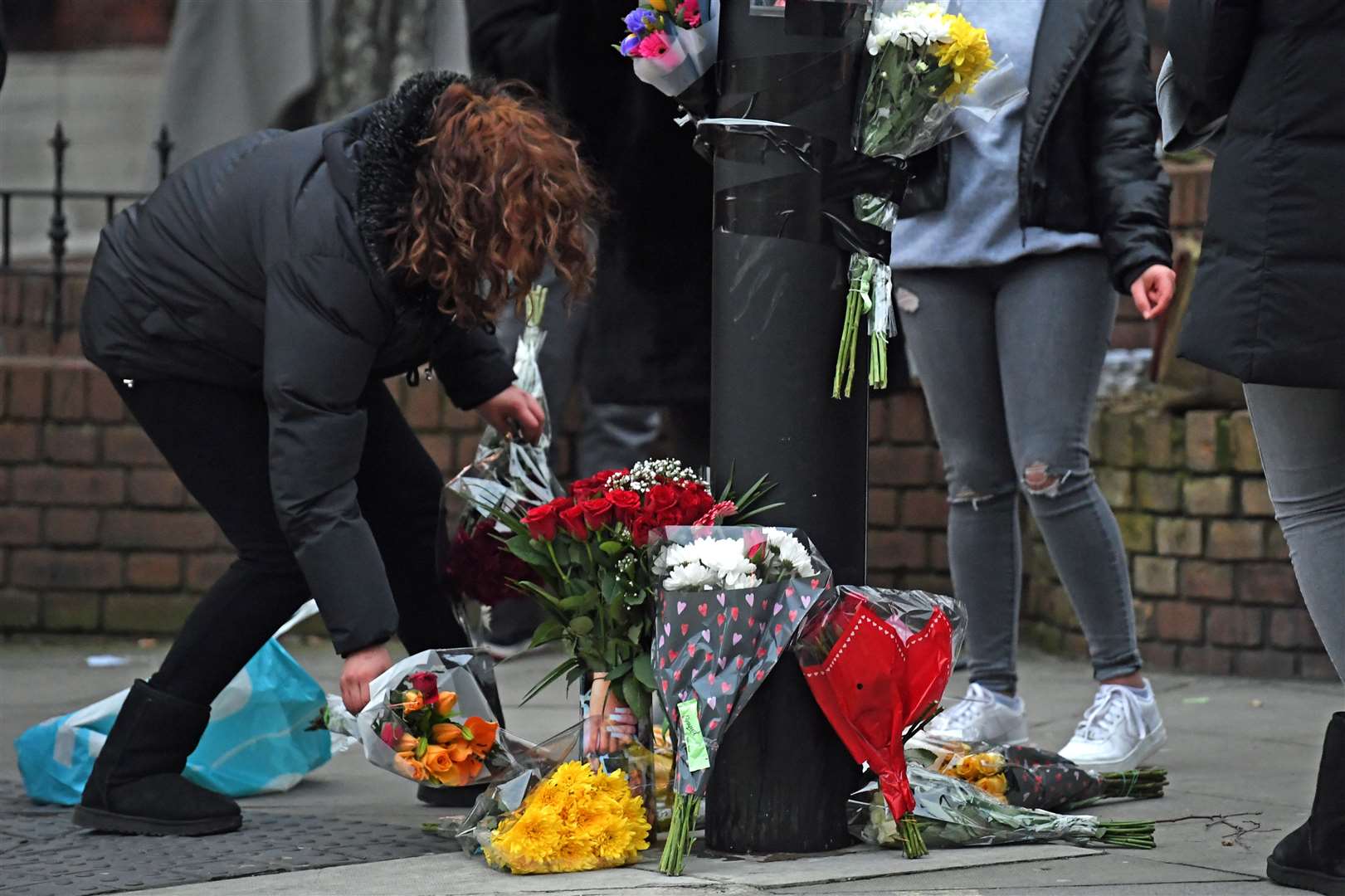 Floral tributes were left at the scene (Kirsty O’Connor/PA)