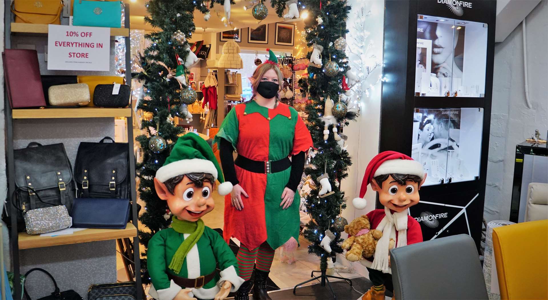 Riverside Interiors assistant manager Roisin Haughey along with two mechanical elves that children loved. Picture: DGS