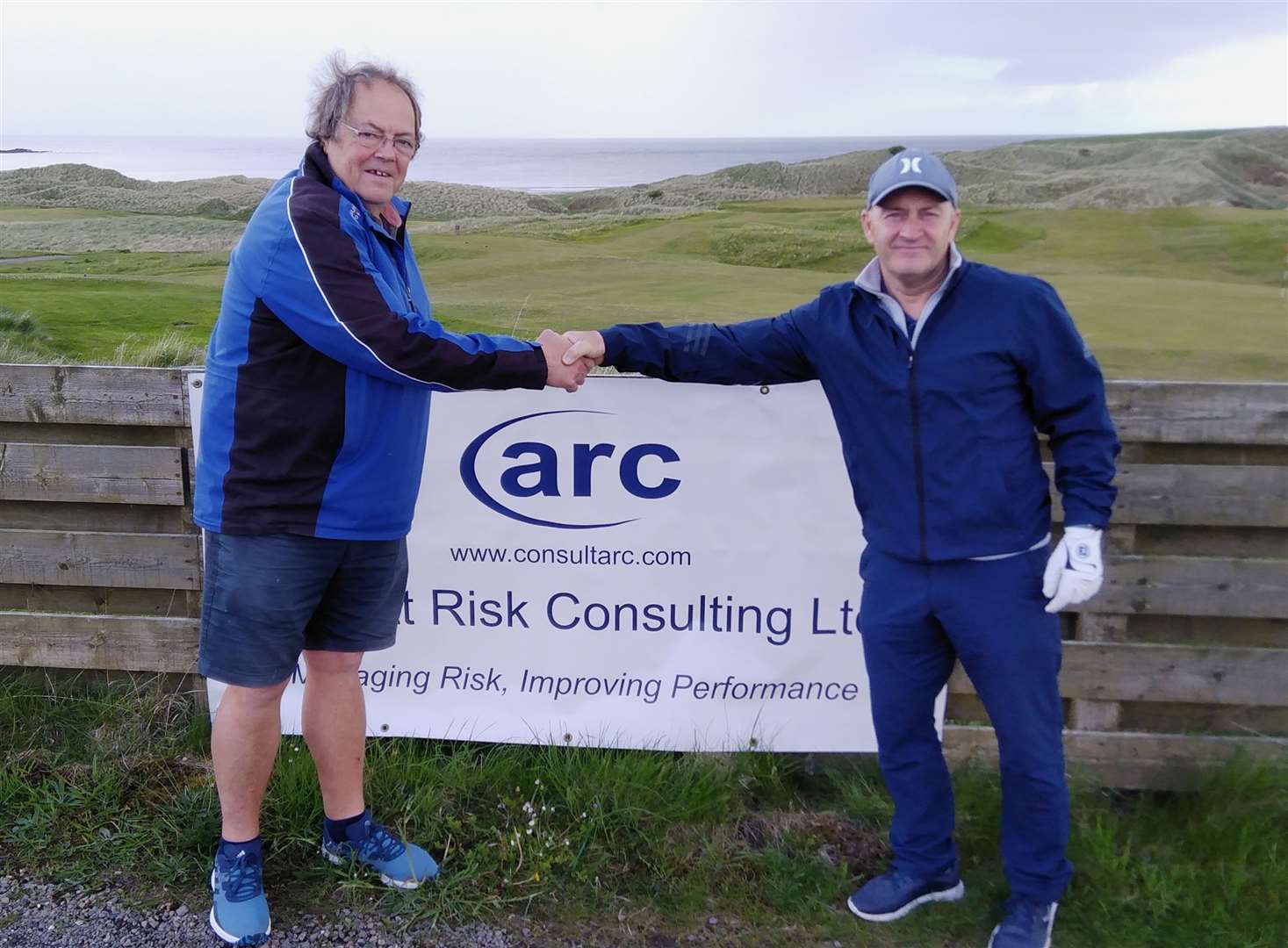 Willie Steven (right), winner of the recent ARC Open Stableford, being congratulated by Mike Halliday.