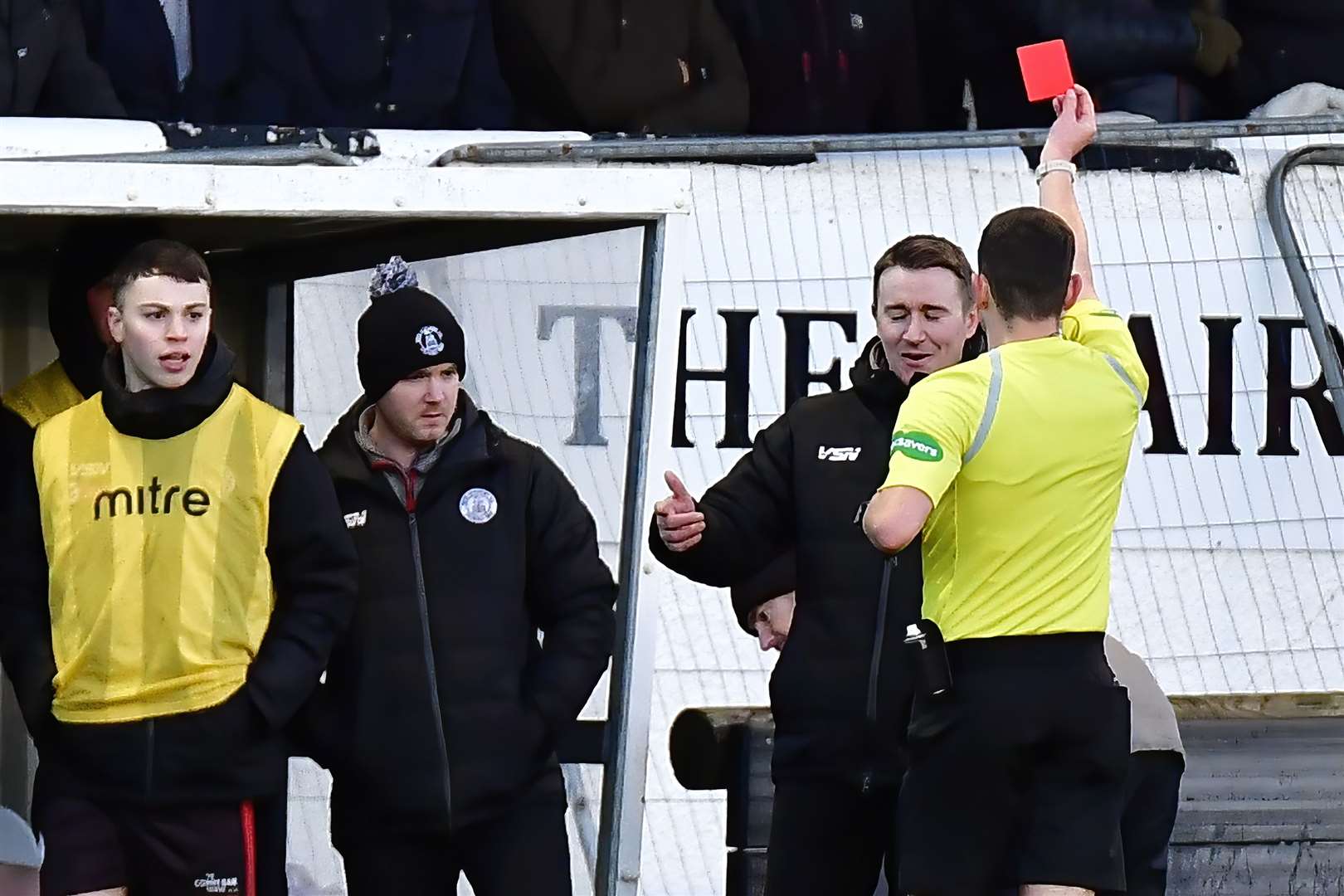 Referee Scott Donohoe shows the red card to Wick Academy manager Gary Manson during the first half of Saturday's match at Harmsworth Park. Looking on are substitute Conor Farquhar and goalkeeping coach James More. Picture: Mel Roger