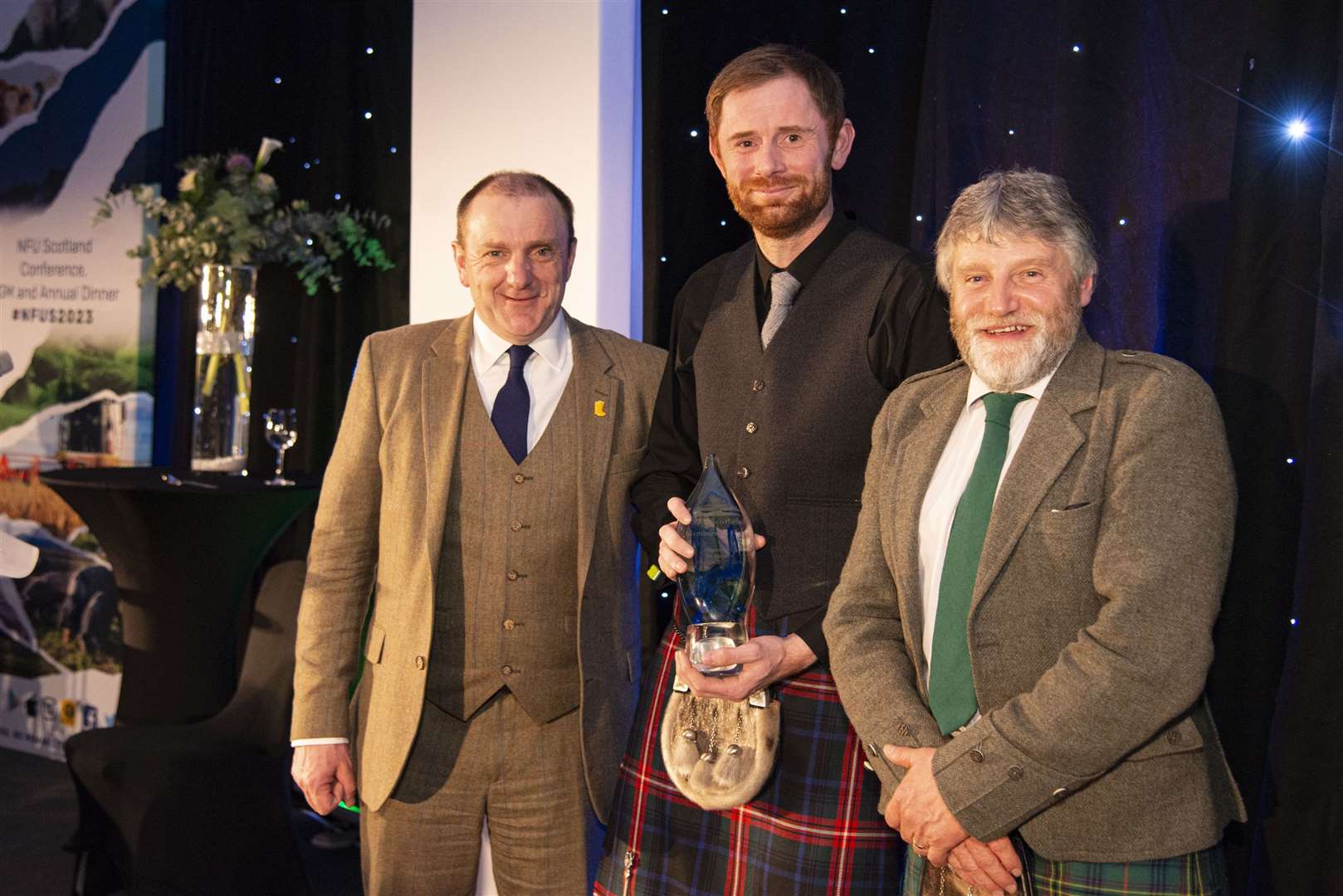 Jonathan Hogg from the Thurso and Dingwall offices collecting NFU Scotland's Membership Flame from NFU Mutual chairman Jim McLaren (left) and union president Martin Kennedy in 2023. Having won the award for the third year running, Mr Hogg and Mr Laing were unable to receive it in person at NFU Scotland’s 2024 annual dinner in Glasgow.