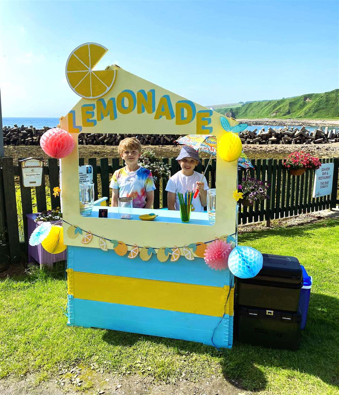 Sammie and Ollie Hall from Dunbeath at their lemonade stand near the harbour. The selfless boys have manned the stand in the previous couple of years as well and all money raised has gone to charity.