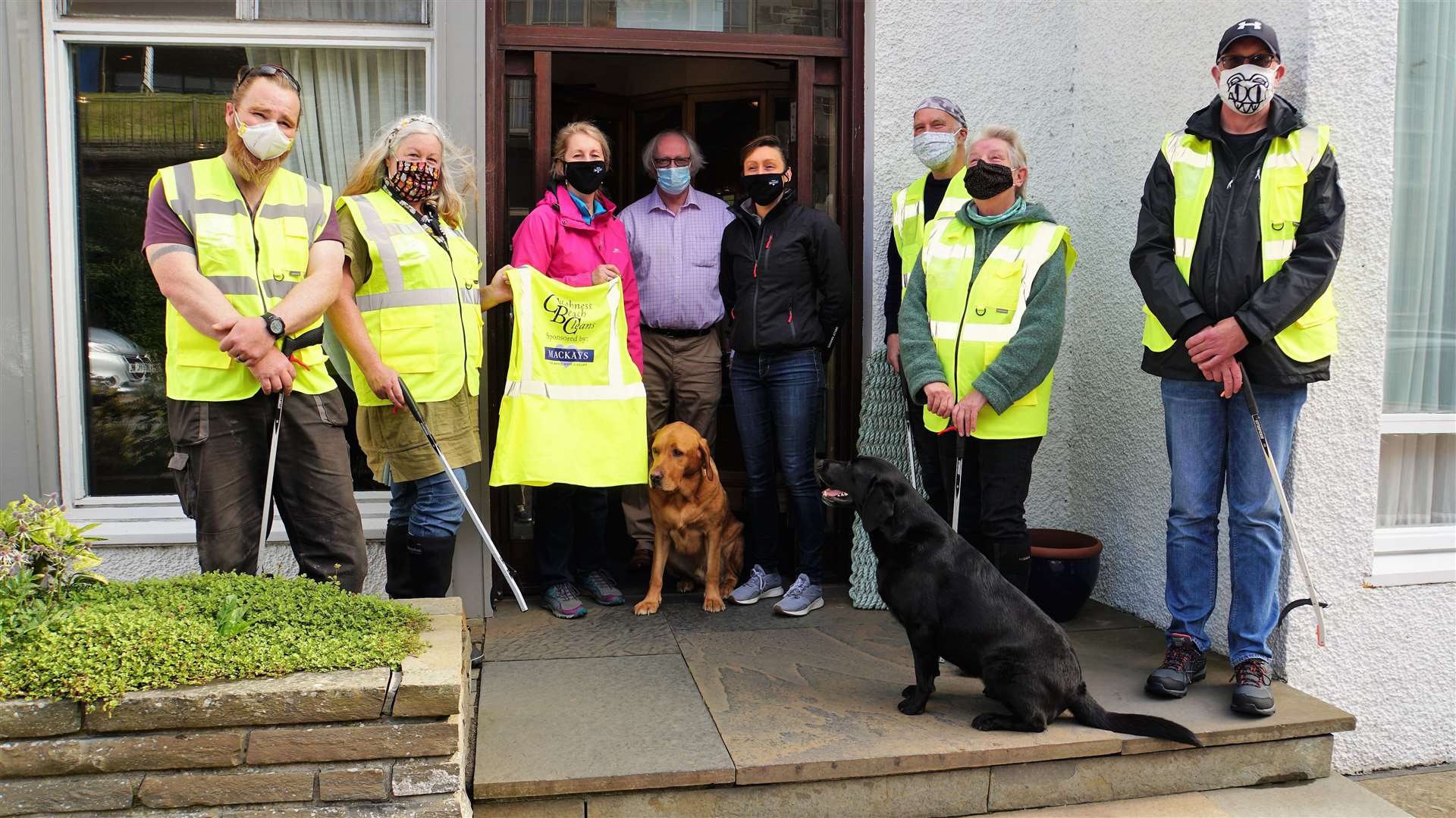 Outside Mackays Hotel on Union Street in Wick are from left Andy and Gabrielle Williams, Ellie, Murray and Jennifer Lamont from Mackays Hotel, Alan and and Dorcas Sinclair, and George Robertson. Hotel dogs Max and Bria are also featured. Pictures: DGS