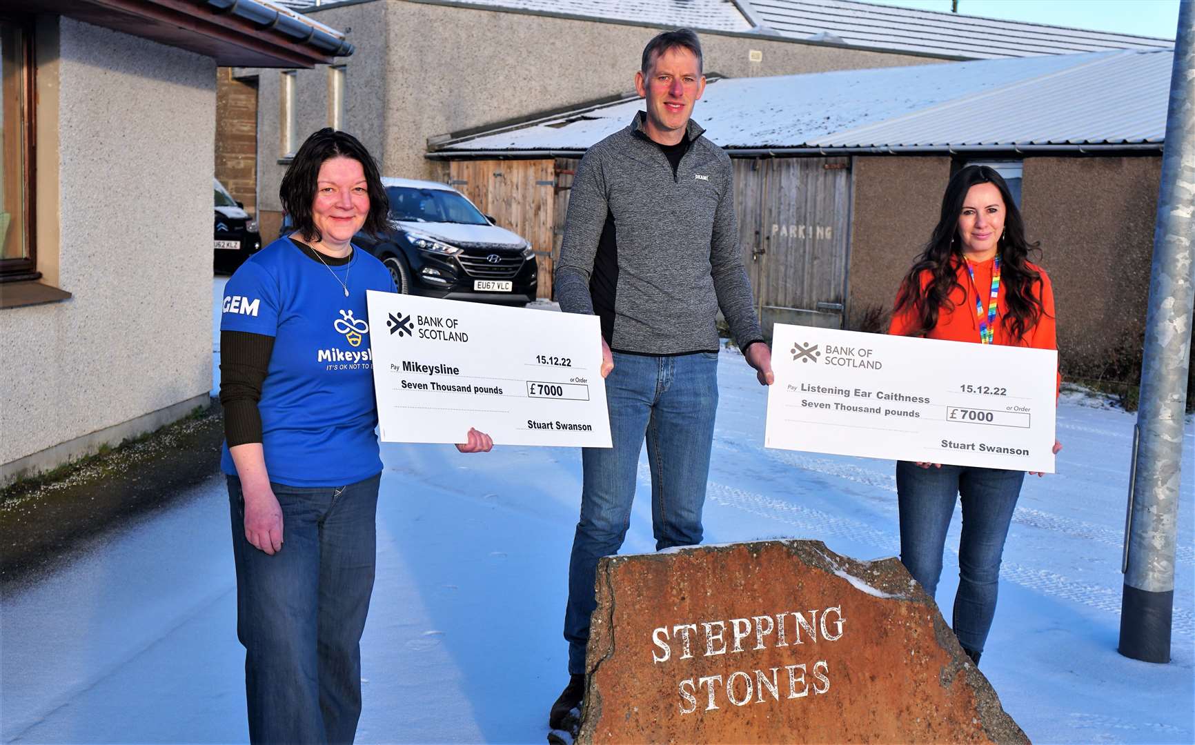 Donna Murray from Mikeysline, at left, with Stuart Swanson and Gail Brown from Listening Ear Caithness with the cheques totalling £14,000. Picture: DGS