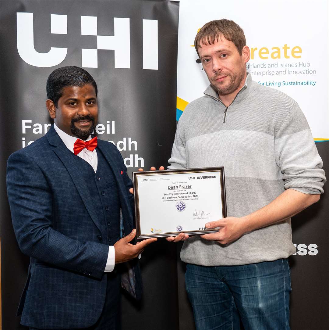 Dean Frazer (right) getting the award from Rojan Kumar Subramani. Picture: Angus Findlay