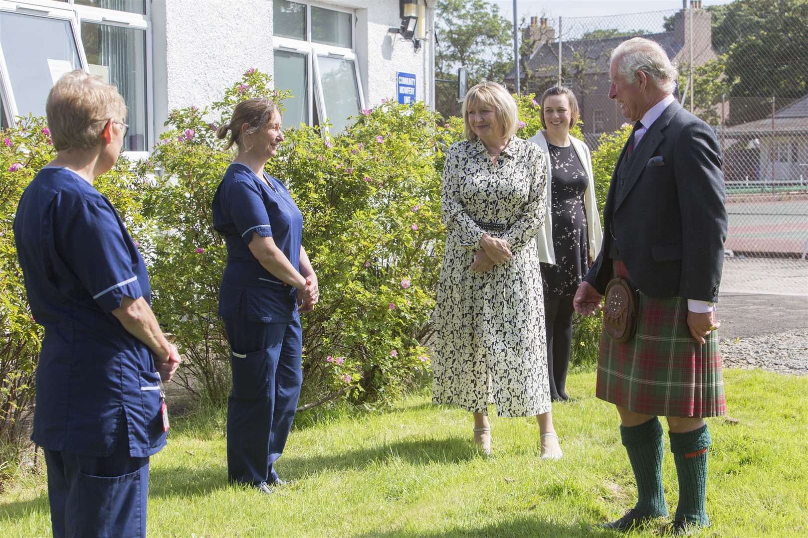 Prince Charles, the Duke of Rothesay, takes time to chat with Pat McGee, charge nurse in the acute medical and surgical admissions ward at Caithness General Hospital, and advanced nurse practitioner Verity Mackay, one of the team leading the infection control ward in Wick, while looking on are hospital manager Pam Garbe and biomedical scientist Laura Taylor. Picture: Robert MacDonald / Northern Studios