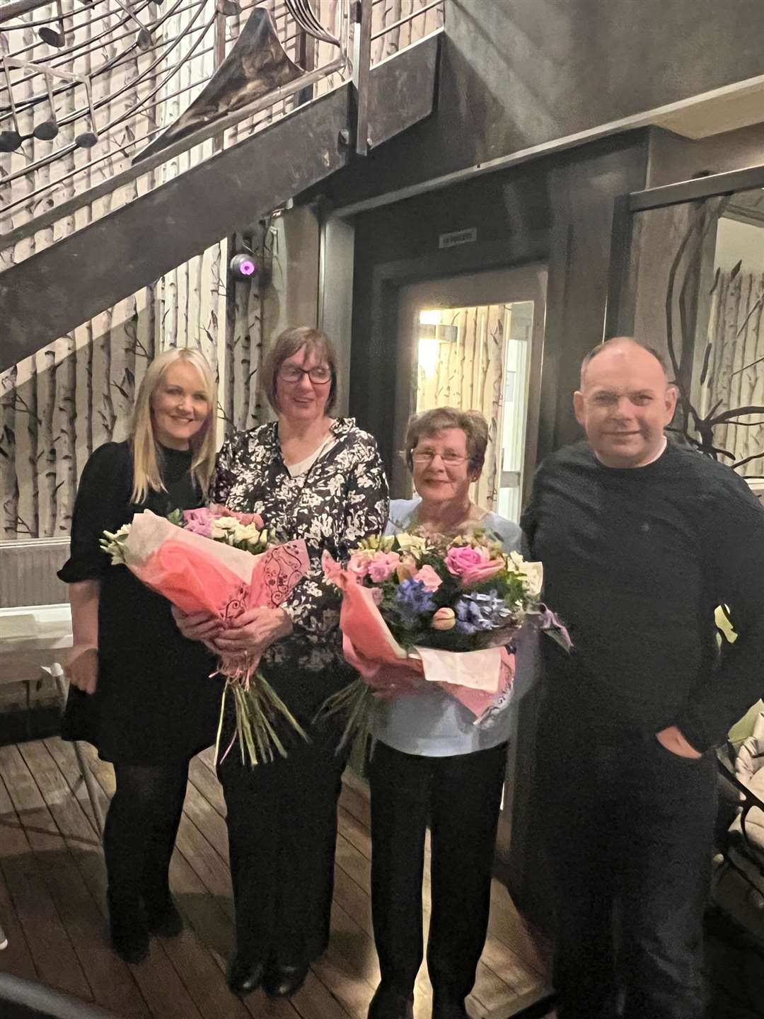 Gary and his wife Tracy (left) after presenting the bouquets to Gary's mother Joyce and staff member Maureen Webster.