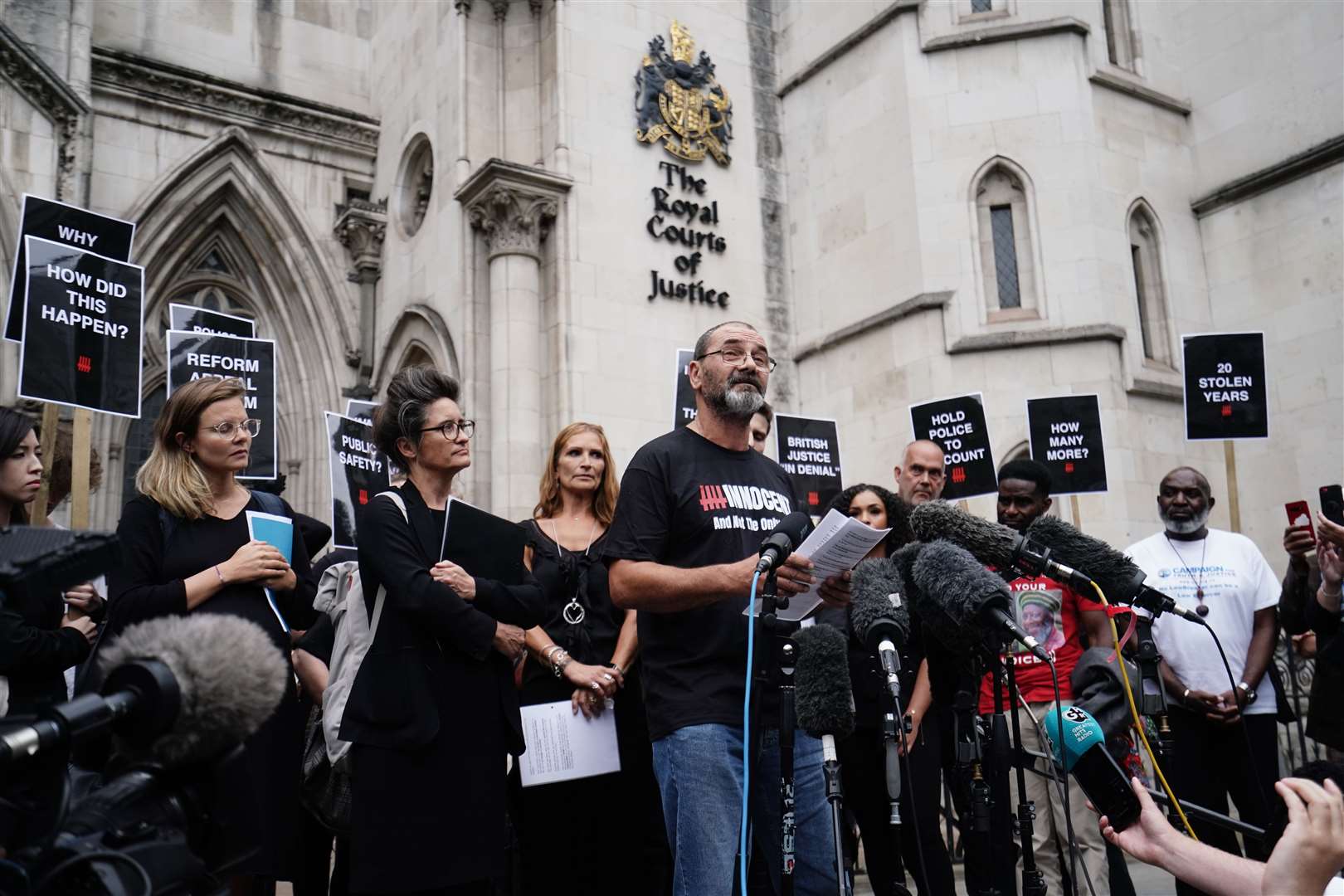 Andrew Malkinson, who served 17 years in prison for a rape he did not commit, reads a statement outside the Royal Courts of Justice in London after being cleared by the Court of Appeal (Jordan Pettitt/PA)