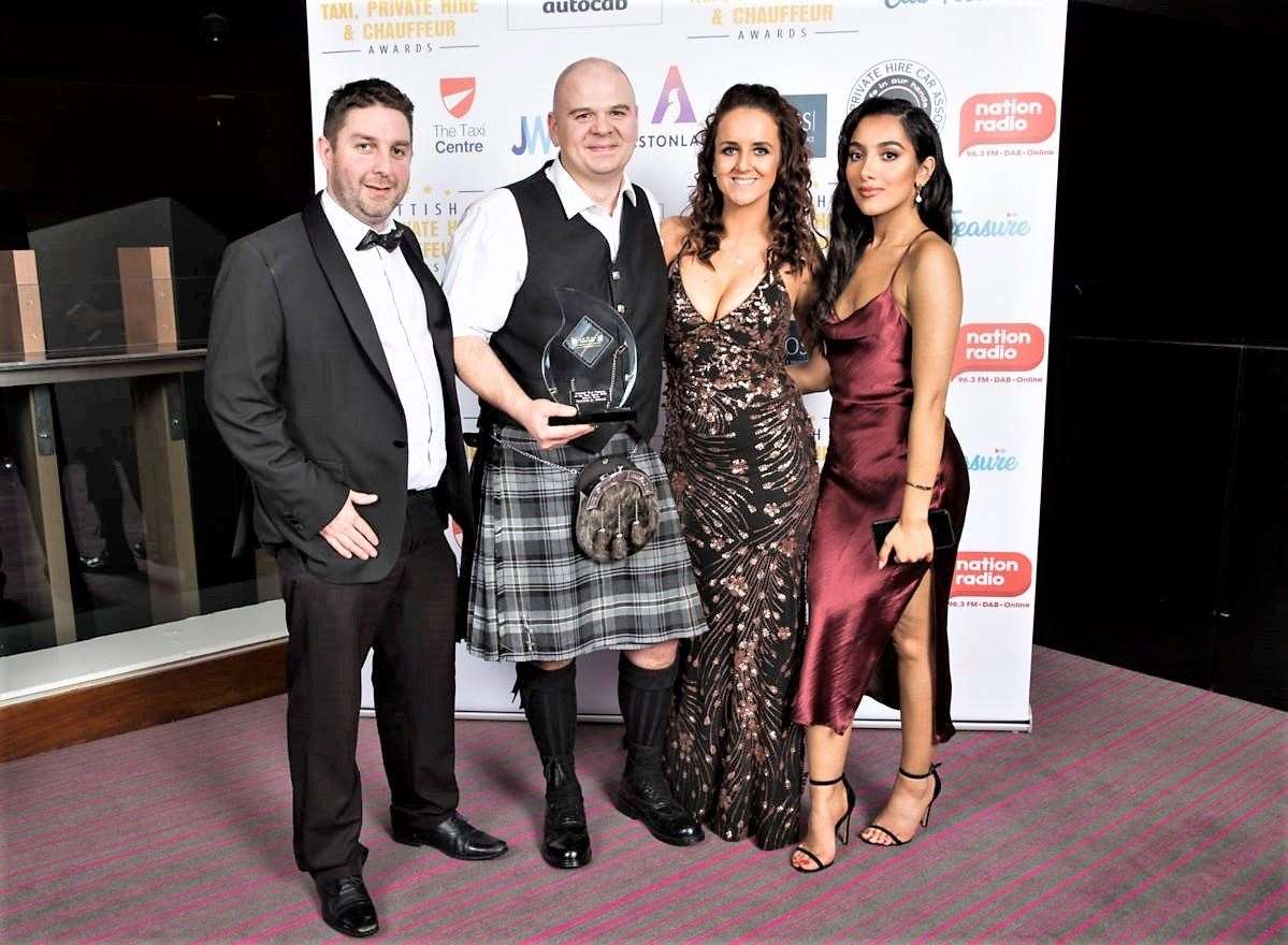 Brian Travers and his partner Lyndsay Gunn flanked by representatives of the sponsor Autocab at the awards ceremony. Picture: Steve Welsh