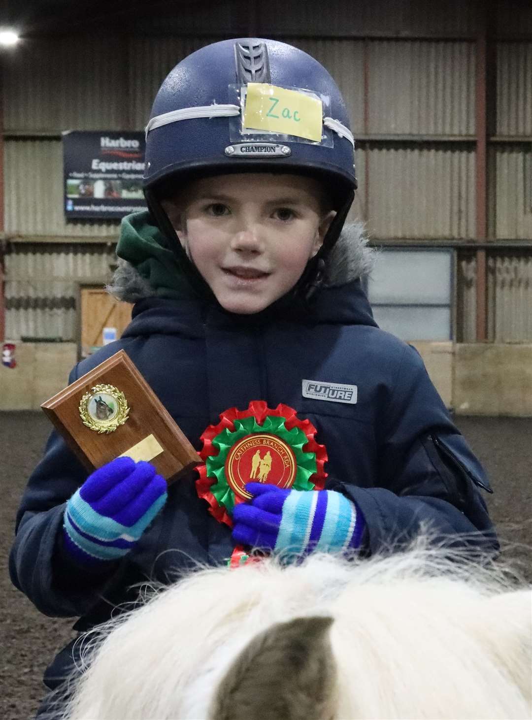 Zac Bain from Ride 1 with his shield for effort and Christmas rosette. Picture: Neil Buchan