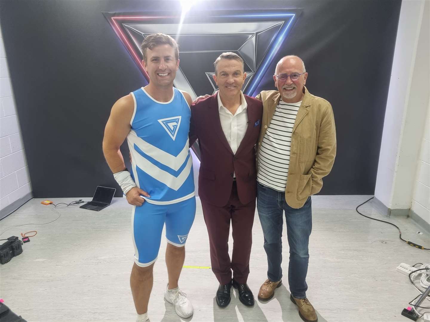 Finlay, Gladiators presenter Bradley Walsh and Evan pose for a photo