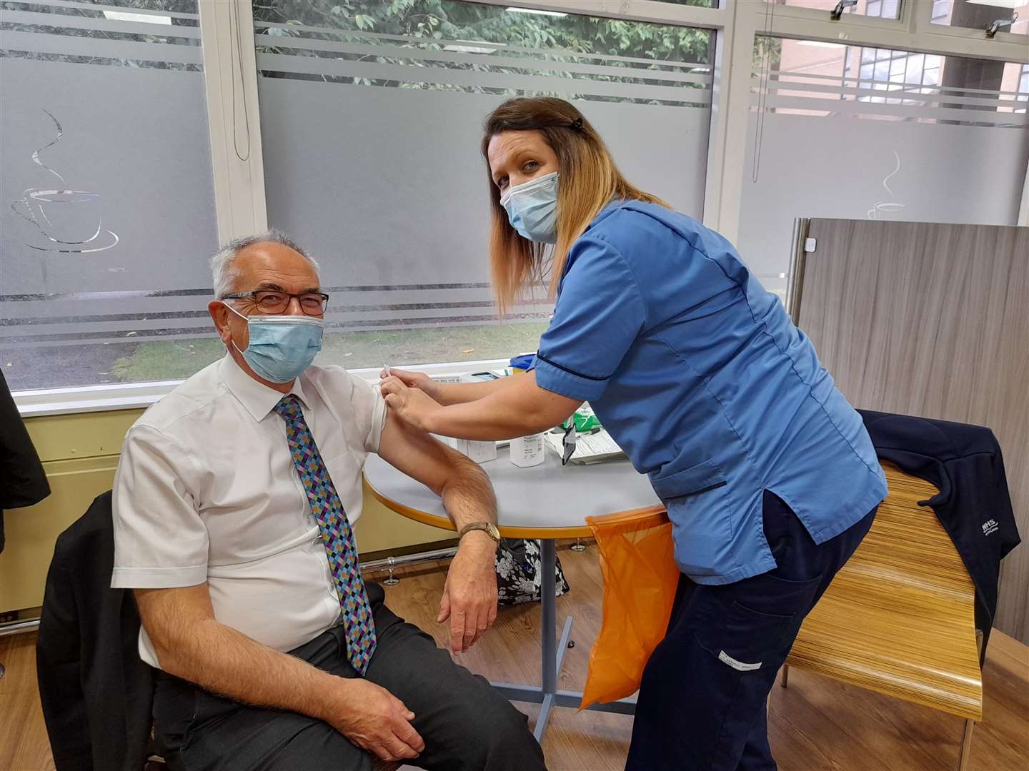 The NHS Highland chairman, Professor Boyd Robertson, receiving his flu vaccination.