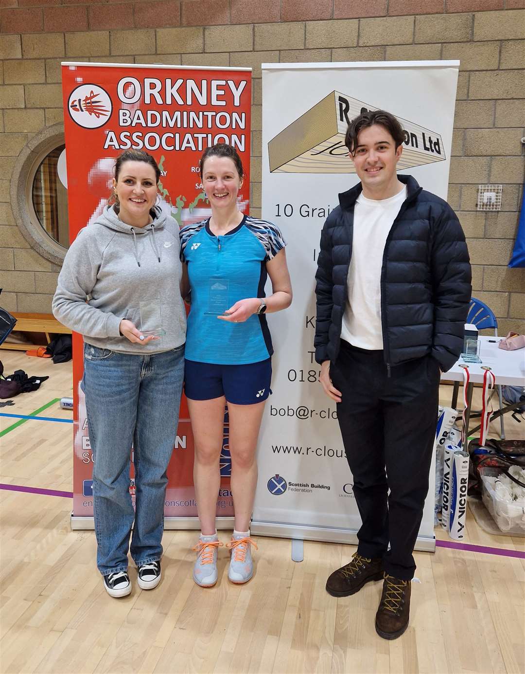 Ladies' doubles winners Lauren Gunn and Shona Mackay with Jamie Clouston from the sponsors.