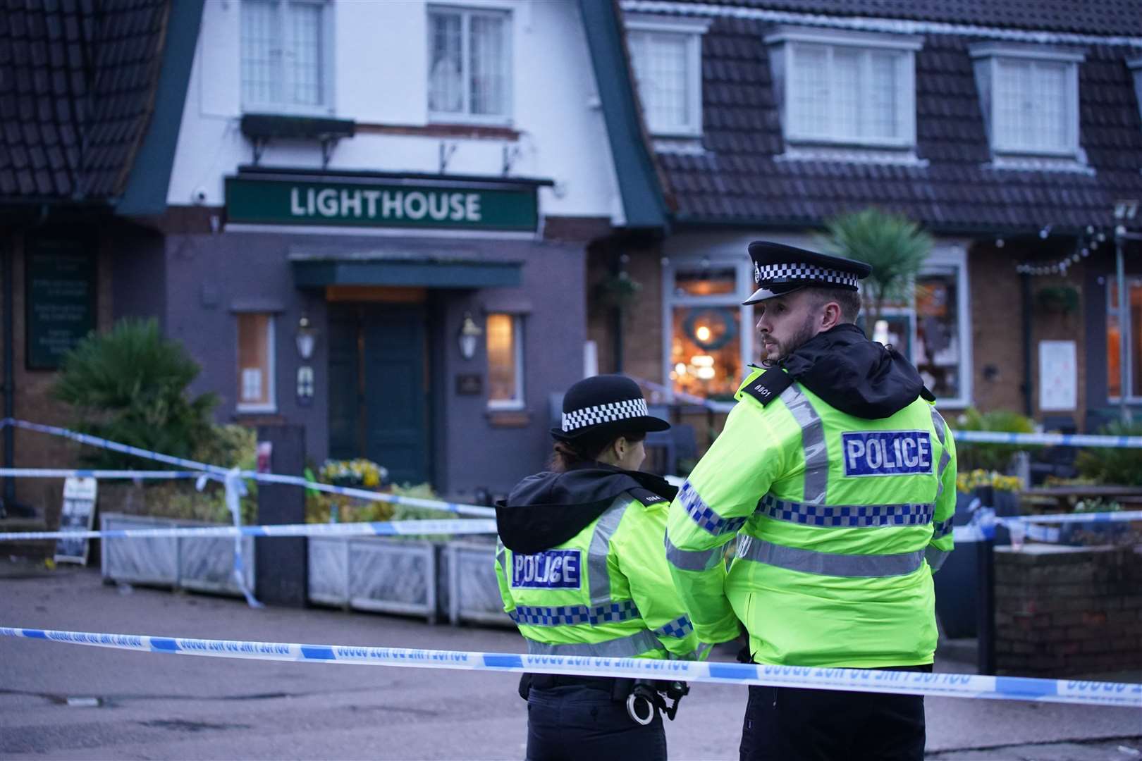 Police officers on duty at the Lighthouse Inn in Wallasey Village (Peter Byrne/PA)