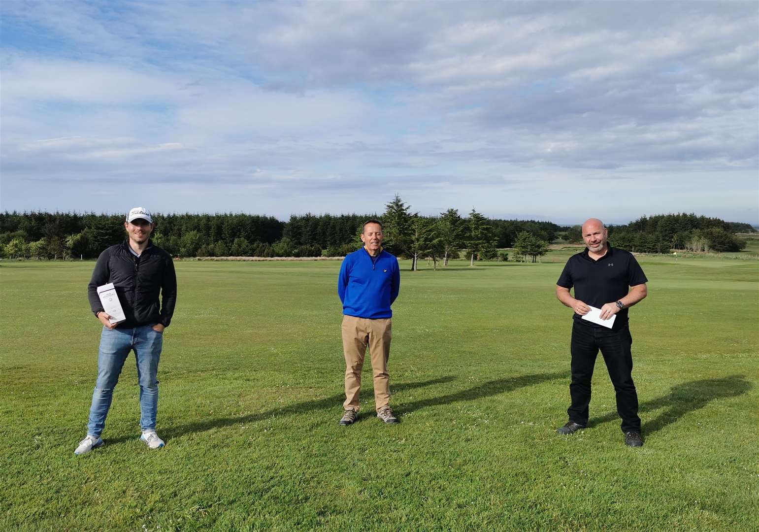 Winner Alan Coghill (centre) with prize recipients Derek Manson (left) and Neil Rigg after the delayed Captain's Prize at Thurso Golf Club.
