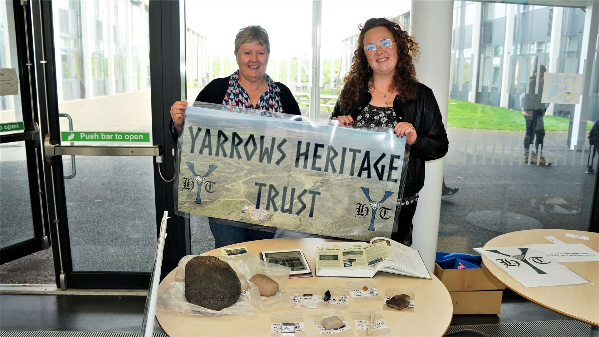 Rhona MacPherson and Holly Young at the Yarrows Heritage Trust stand. The Trust has been undertaking an archaeological dig near Thrumster. Picture: DGS