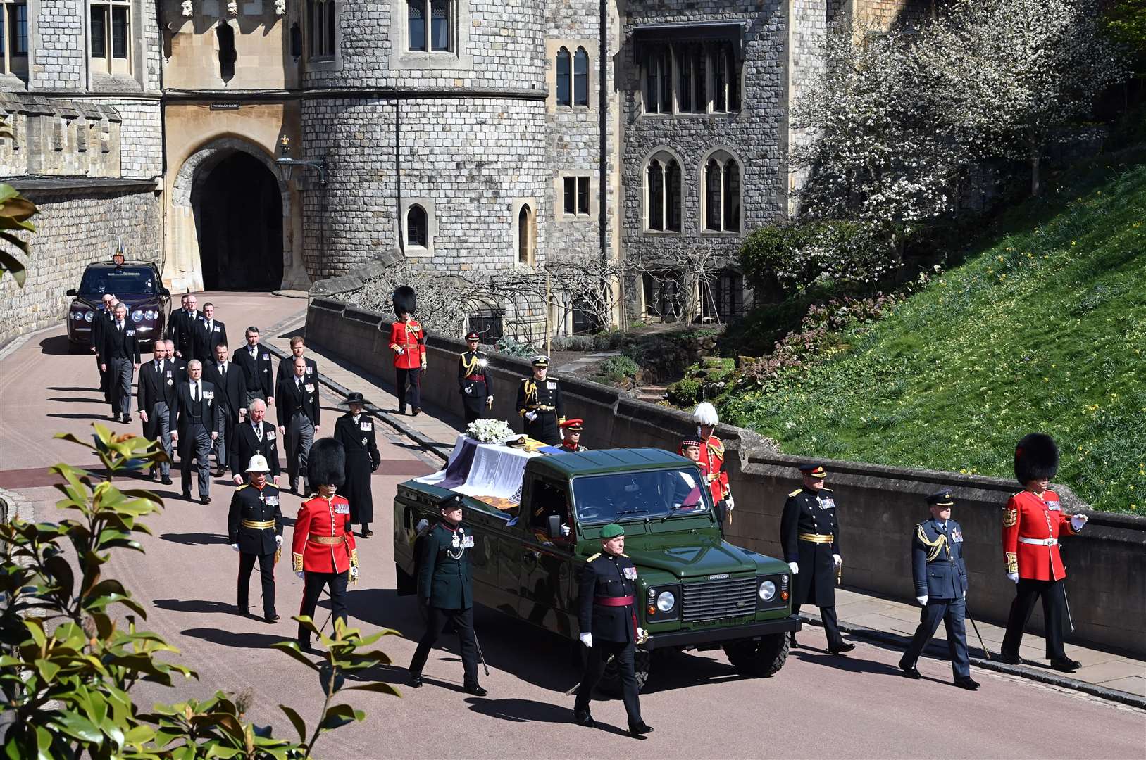 The Land Rover Defender carrying the coffin of the Duke of Edinburgh is followed by members of the royal family (Leon Neal/PA)