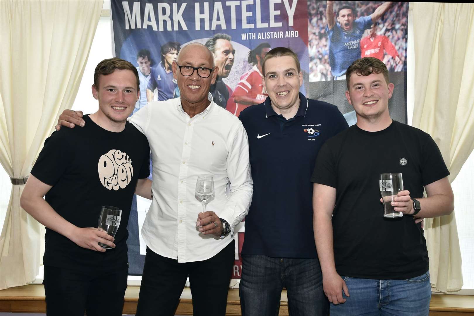 Glass mementoes were presented to Mark Hateley and the Rangers coaches. From left: Calum Ross (Rangers coach), Mark Hateley, Alyn Gunn (Thurso Football Academy) and Zander Carruth (Rangers coach). Picture: Mel Roger