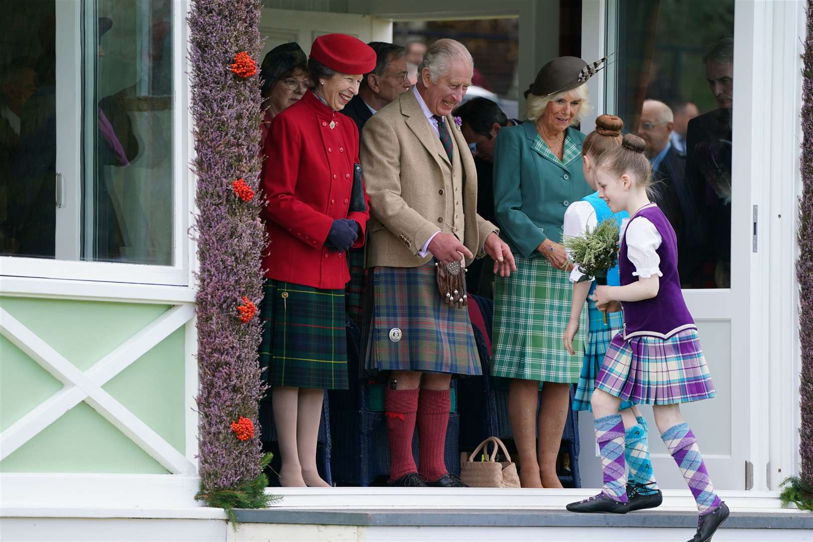 Young Highland dancers present flowers to the royal party (Andrew Milligan/PA)