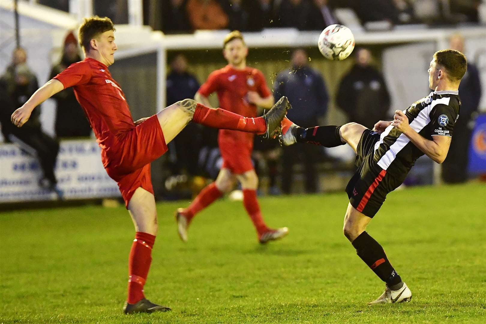Kyle Macleod of Brora and Jack Henry of Wick Academy challenge for the ball during Wednesday night's north derby. Picture: Mel Roger