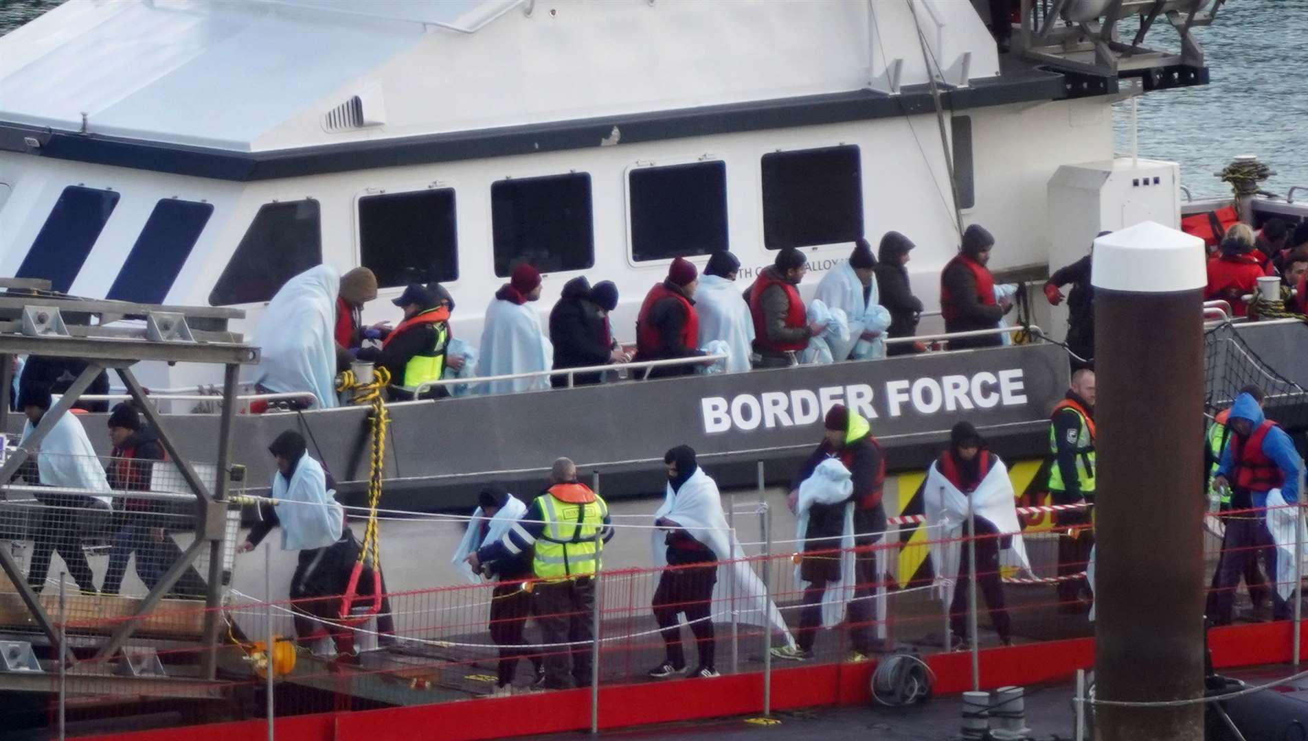 A group of people thought to be migrants are brought in to Dover, Kent, on a Border Force vessel following a small boat incident in the Channel (Gareth Fuller/PA Wire)