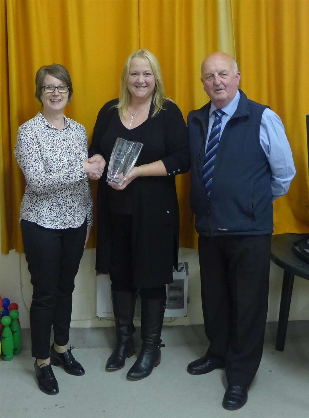 Claire McIntosh (centre) receives the Scottish Association of Local Sports Councils' Service to Sport award from national development officer Gail Prince at the Pentland Firth Yacht Club in Scrabster. Looking on is Caithness Sports Council executive member and local Enable chairman Willie Mackay.