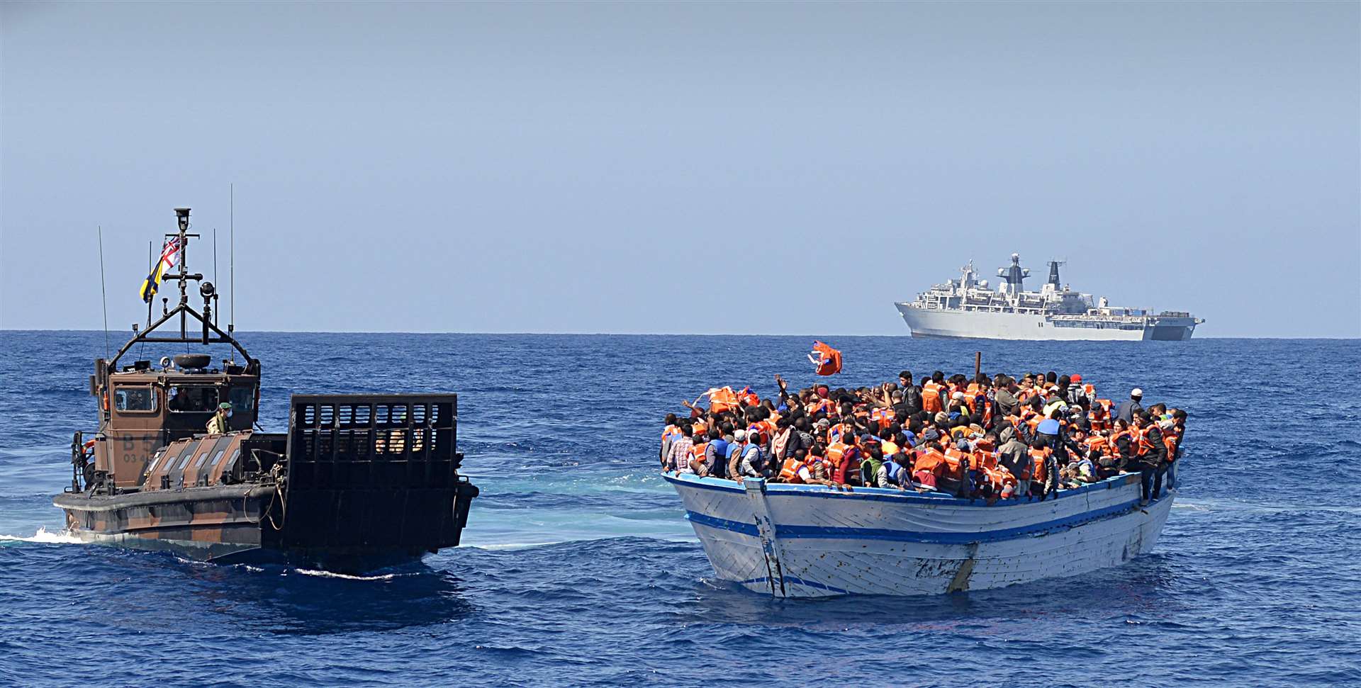 Migrants crammed into a heavily overcrowded wooden boat off the coast of Libya (MoD/PA)