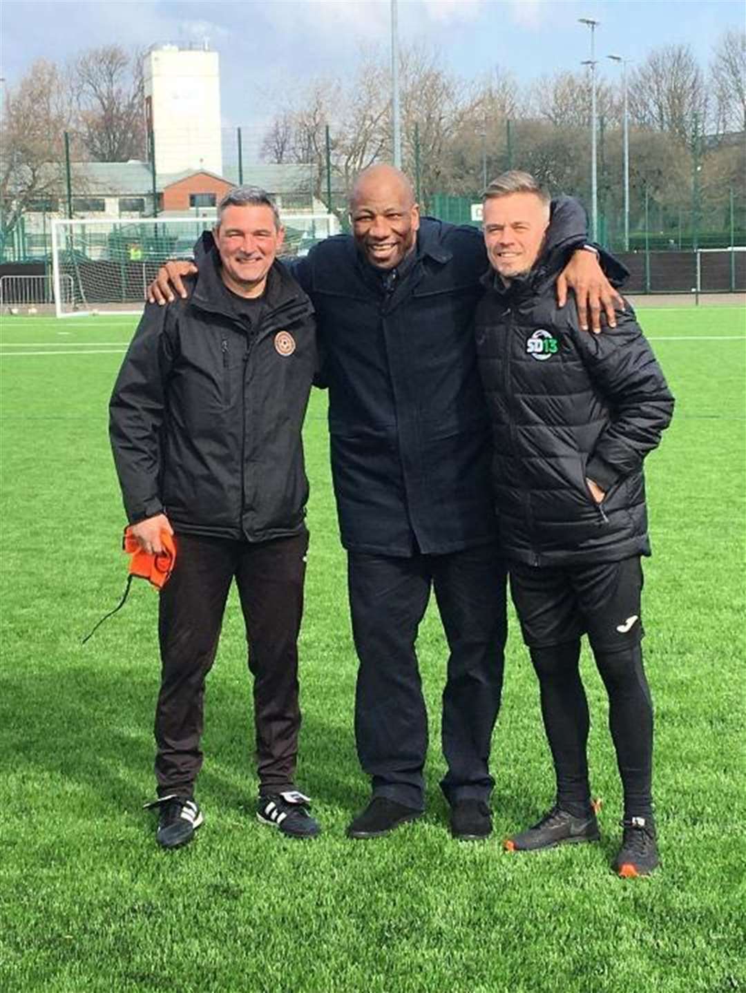 Former Rangers star Charlie Miller (left) and ex-Celtic striker Simon Donelly (right) are pictured with another Rangers old boy Marvin Andrews. Miller and Donnelly will be in Thurso this summer to help run a soccer school.