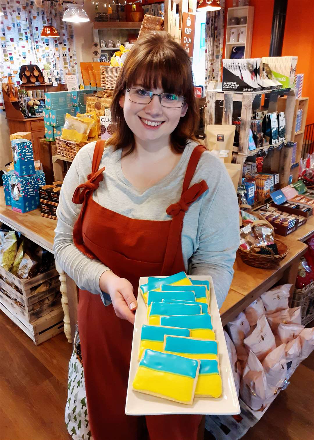 Rebecca Wymer with some of the fundraising Ukrainian flag cookies at Stacks this morning. Picture: Alan Hendry