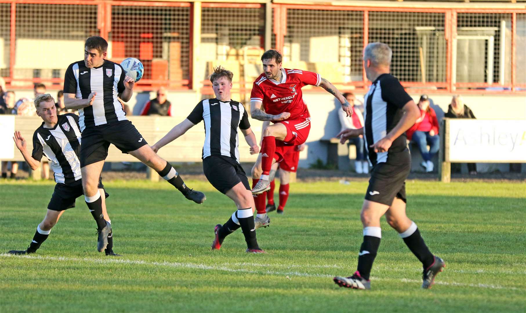 A shot by Wick Groats' Liam Bremner is blocked by Swifts defender Gary Mackay. Picture: James Gunn