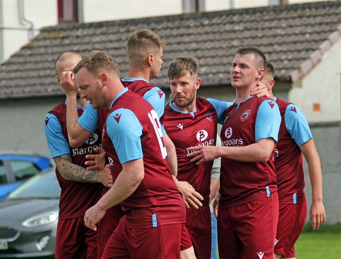 Andy Mackay (right) is congratulated by his team-mates after putting Pentland United 2-1 up. Picture: James Gunn
