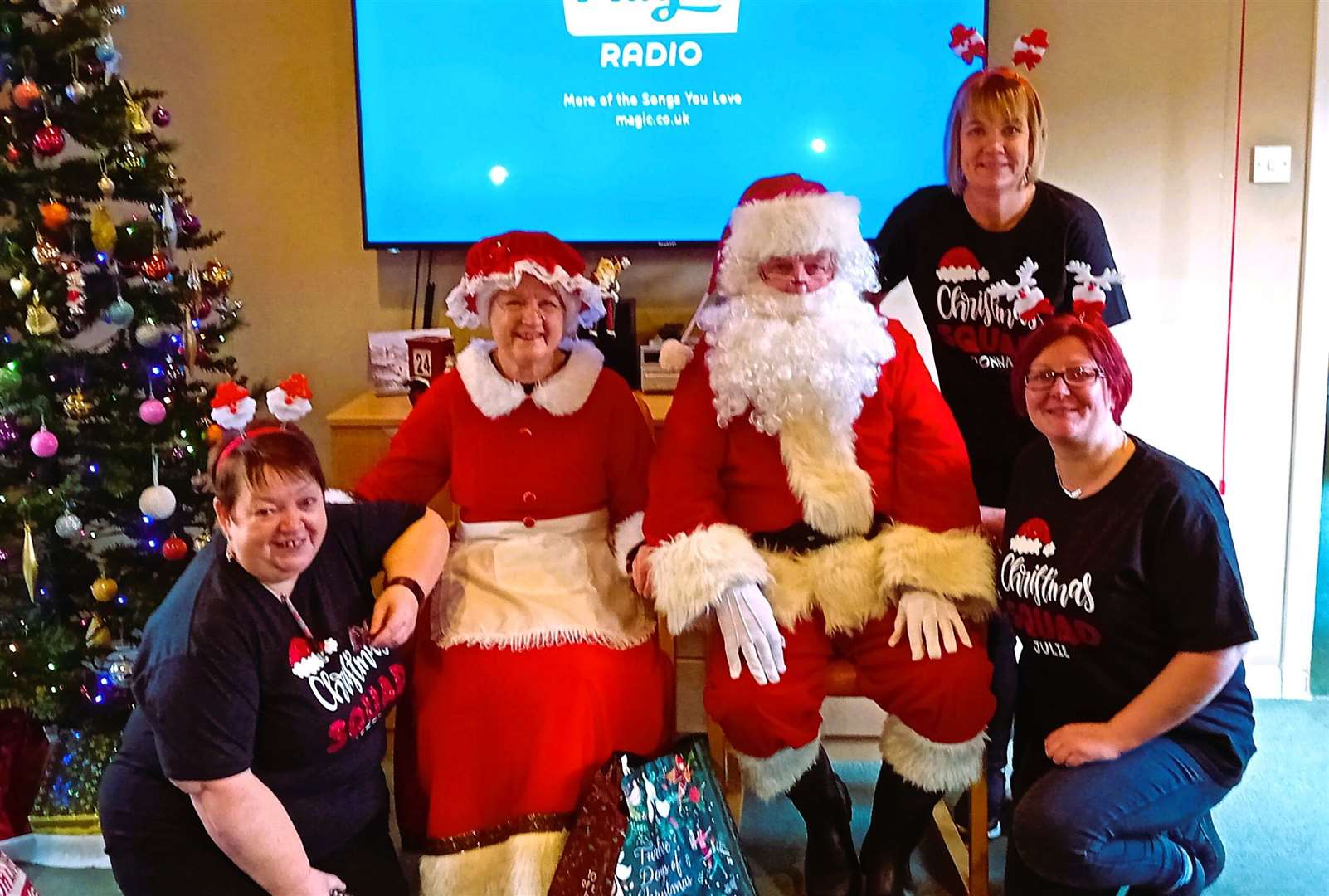 Santa and Mrs Claus take their seats in Pulteney House care home in Wick joined by staff. From left Lizzie, Donna and Julie.