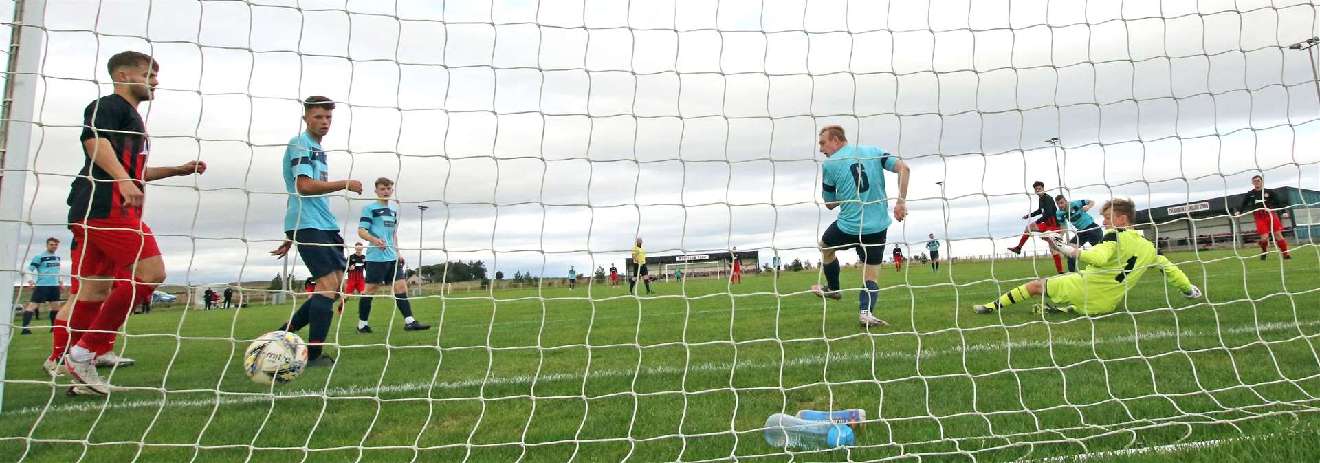 Kyle Henderson fires in Halkirk United's second goal during their North Caledonian League defeat to Alness United at the weekend. Picture: James Gunn
