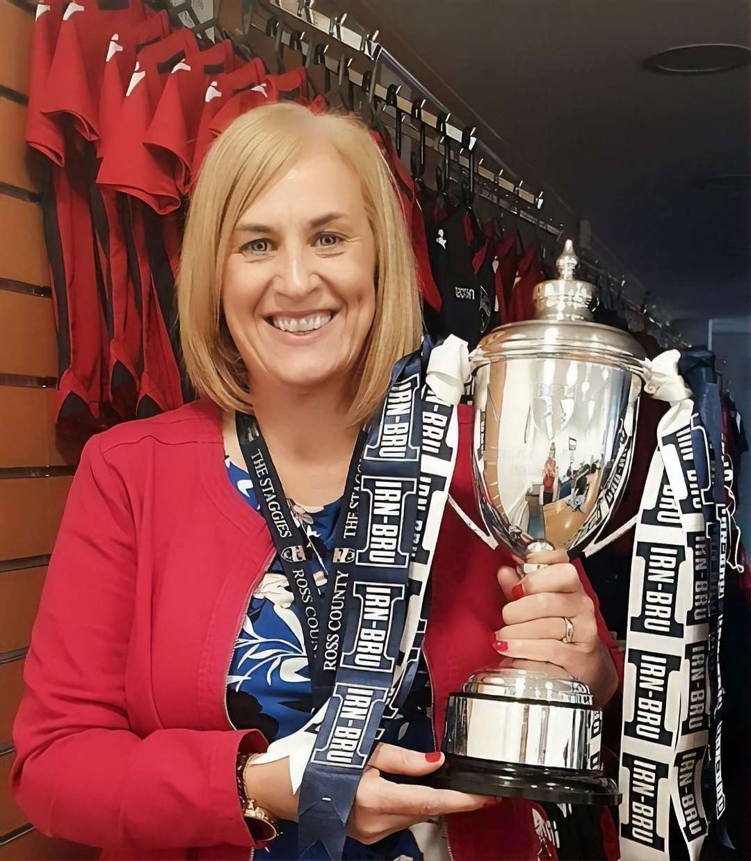 Lorraine holding the IRN-BRU Cup (SPFL Challenge Cup) which Ross County won last season.