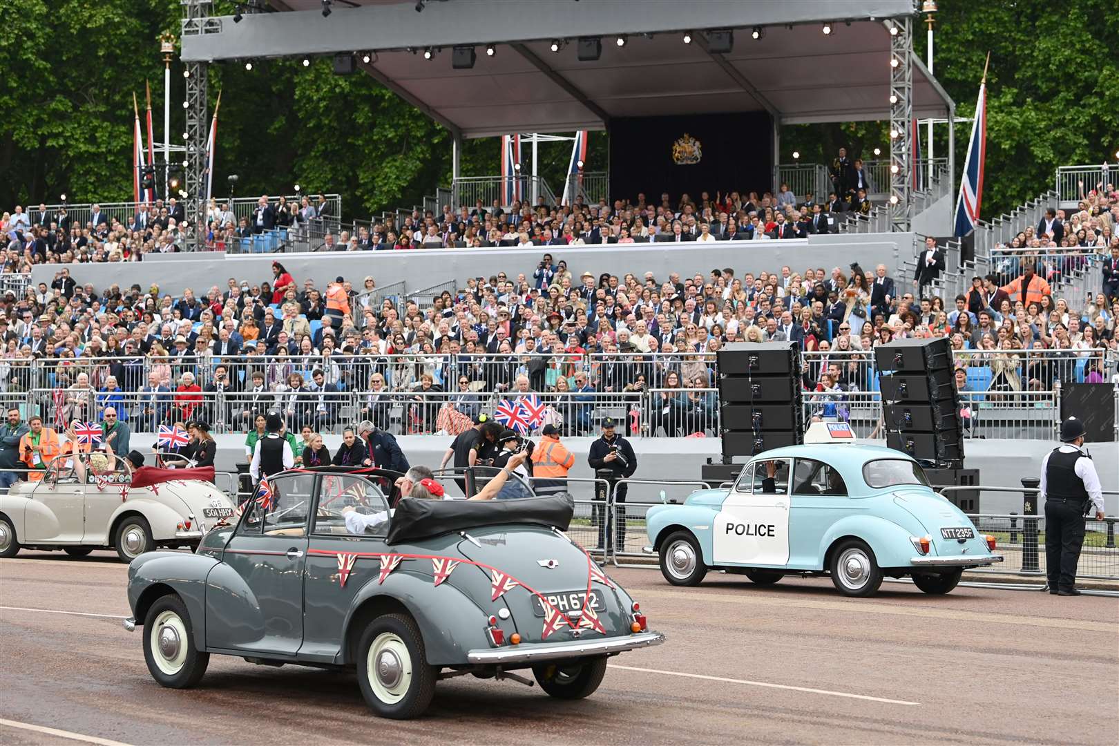 Morris Minors pass the royal box during pageant (Doug Peters/PA)