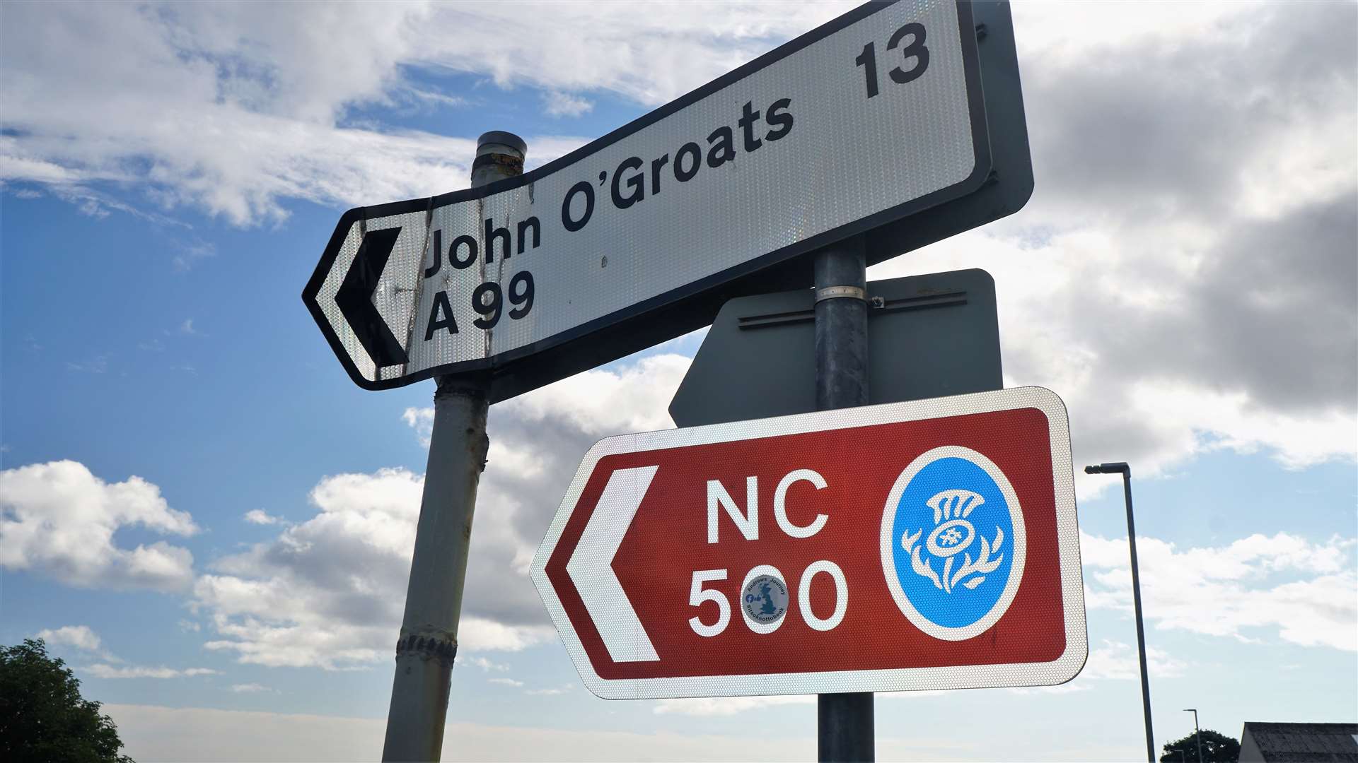 The NC500 route markers at the junction are small and partly obscured by stickers. Picture: DGS