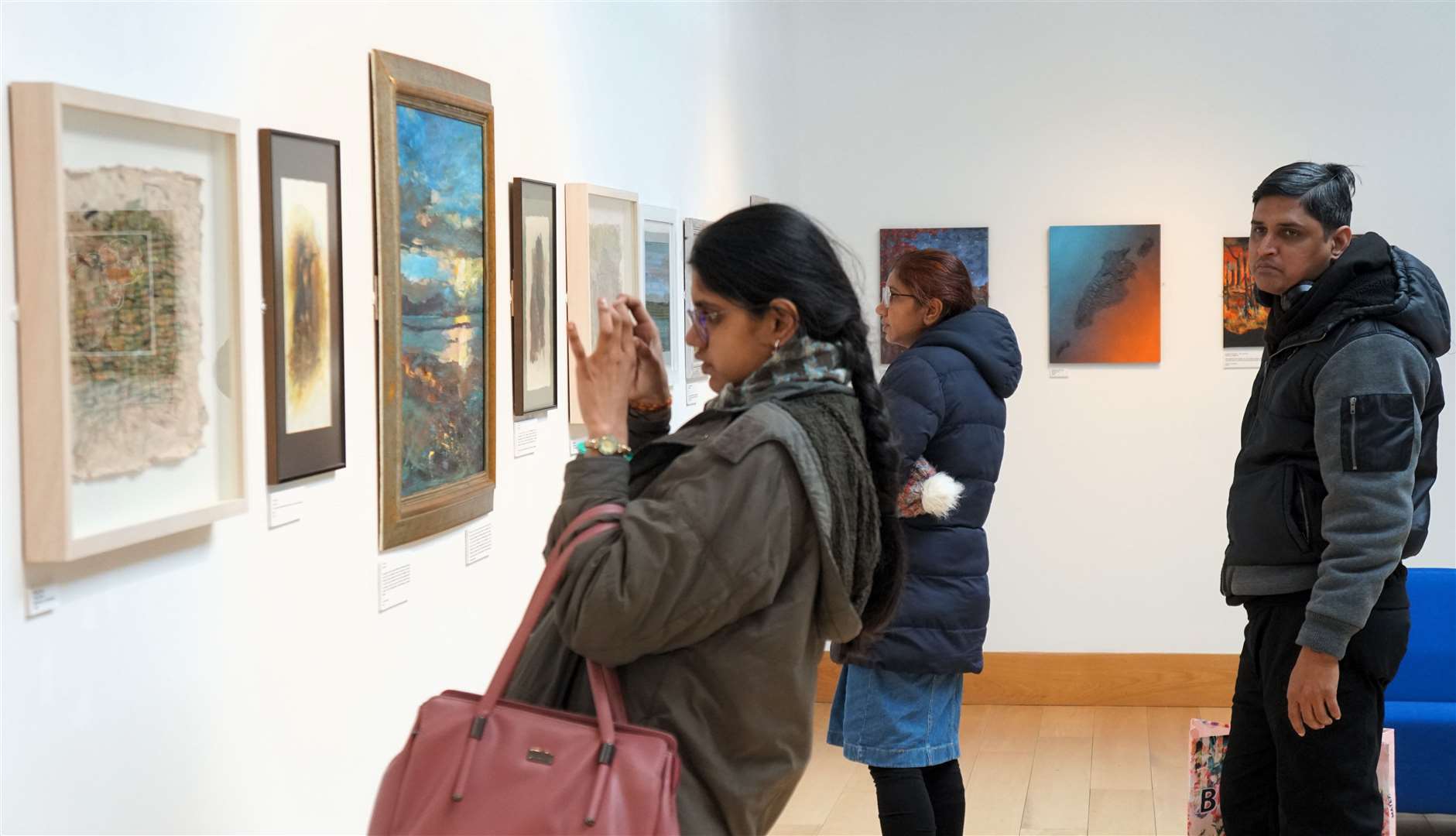 Some of the many visitors at the exhibition of local artworks at the North Coast Visitor Centre in Thurso. Picture: DGS