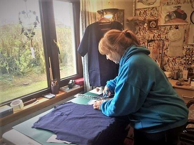 One of the makers, Liz Bamber from Olrig, making scrubs for the NHS.
