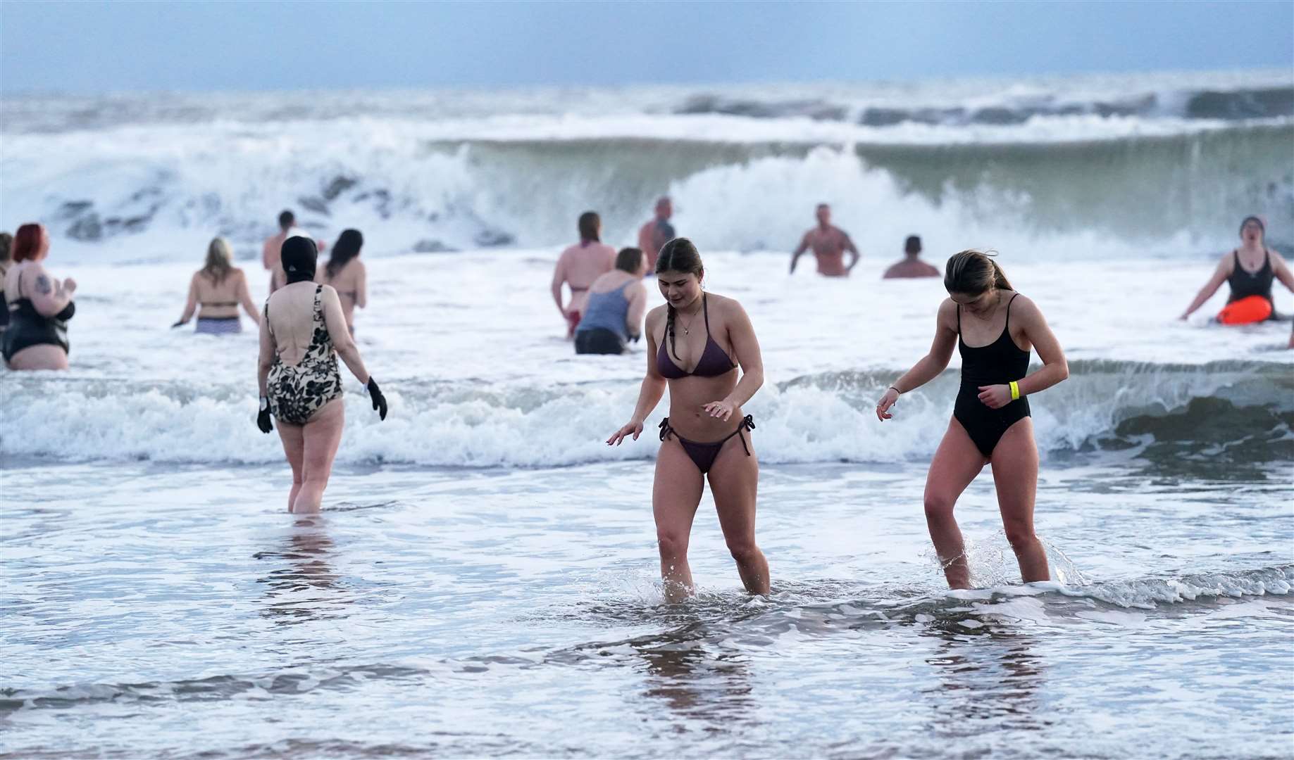 Swimmers brave the freezing conditions near Tynemouth to mark International Women’s Day (Owen Humphreys/PA)