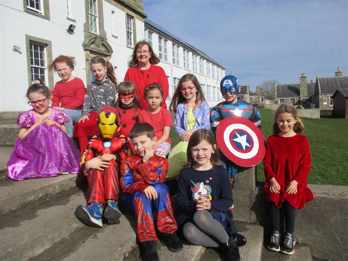 P2 teacher Norma Mackie with her superhero class.