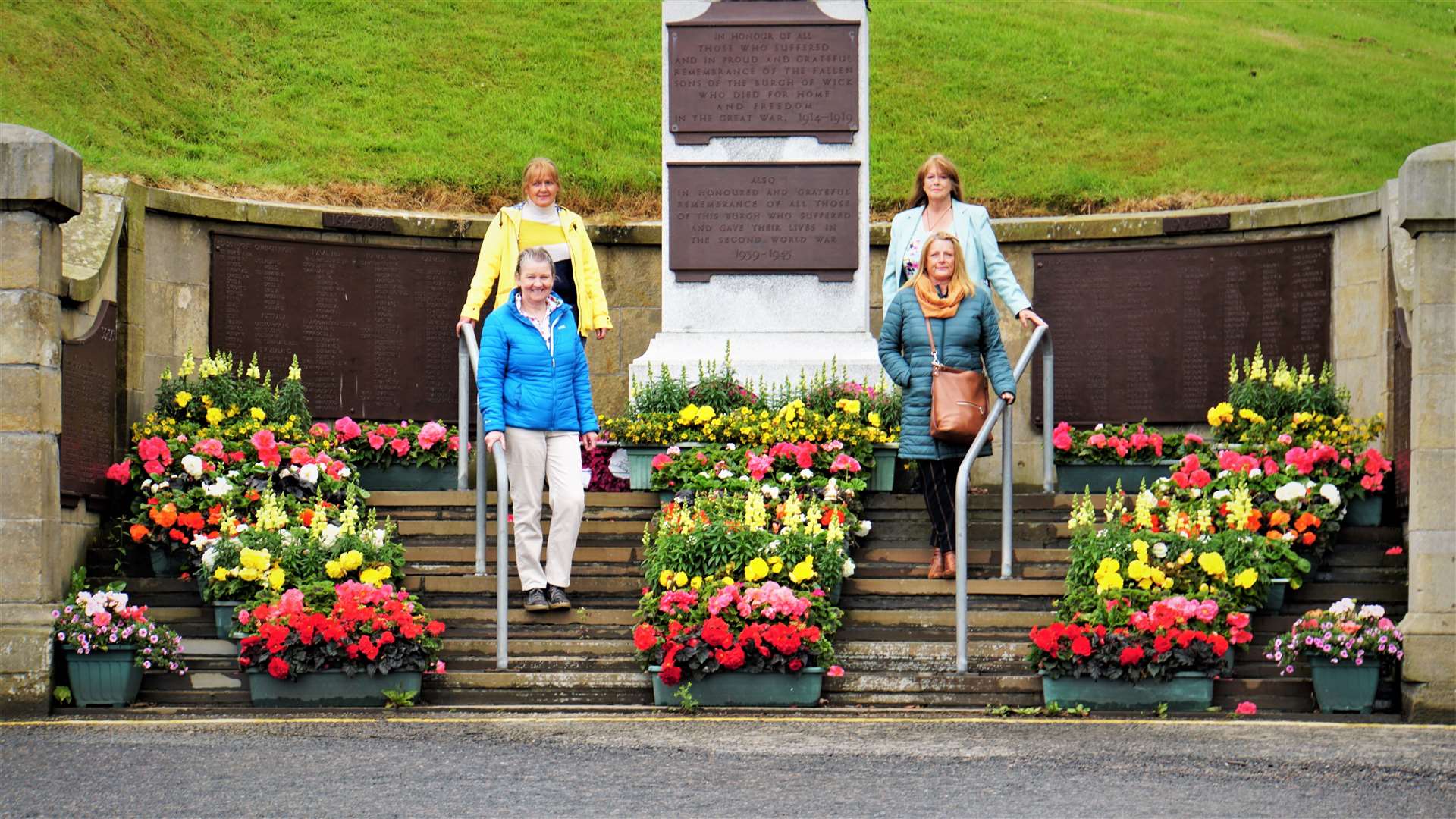 Members of Wick Hanging Baskets Committee at the town war memorial in July 2020. Picture: DGS