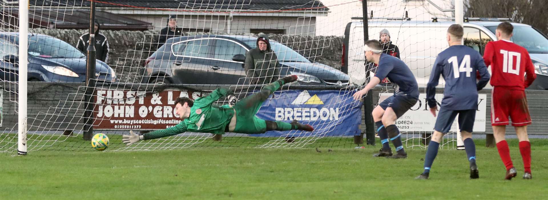 Halkirk keeper Kieran Macleod makes a valiant effort to try and stop John Budge's deflection from crossing the line. Picture: James Gunn